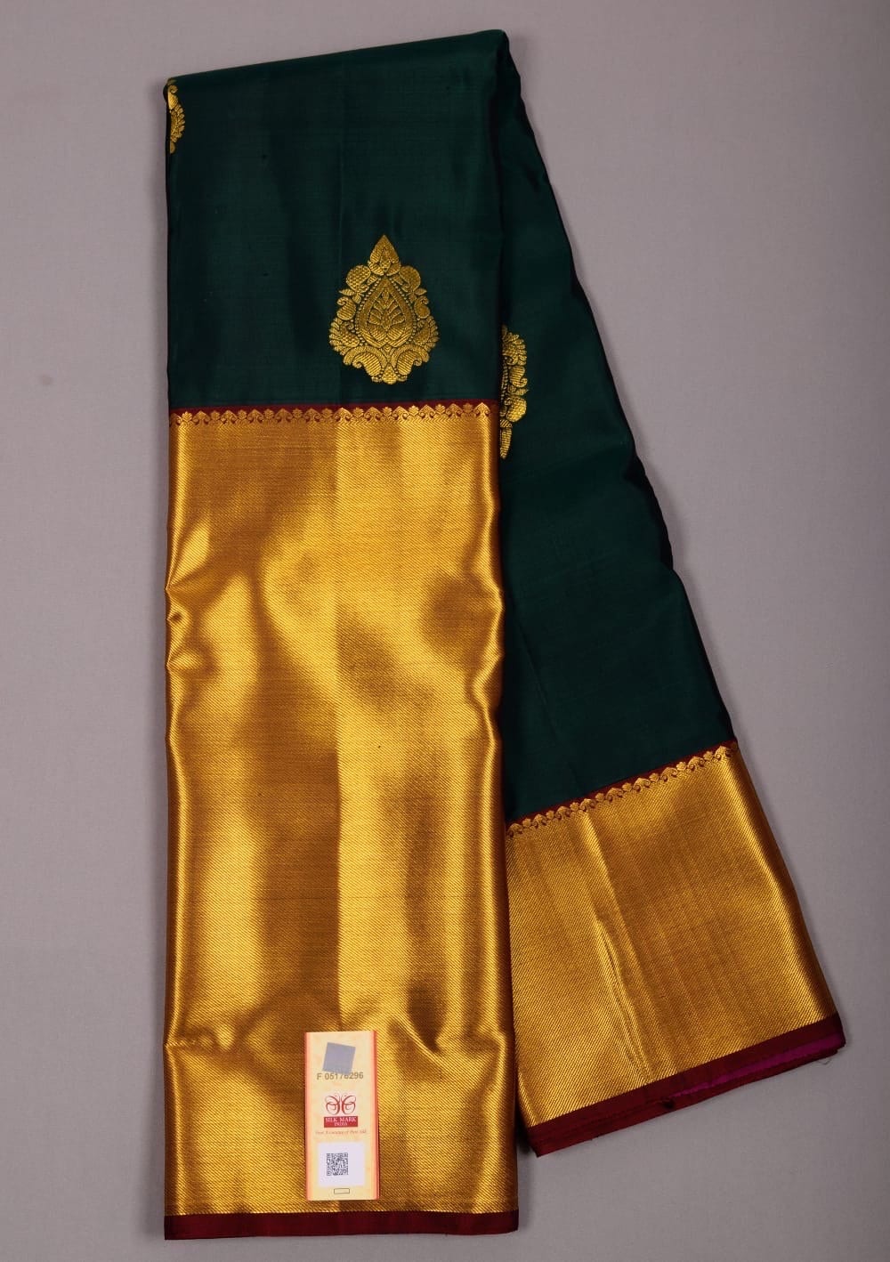 Pure silk Kanchipuram saree in bottle green with maroon colour combination and with beautiful thilagam butta ask seller before placing