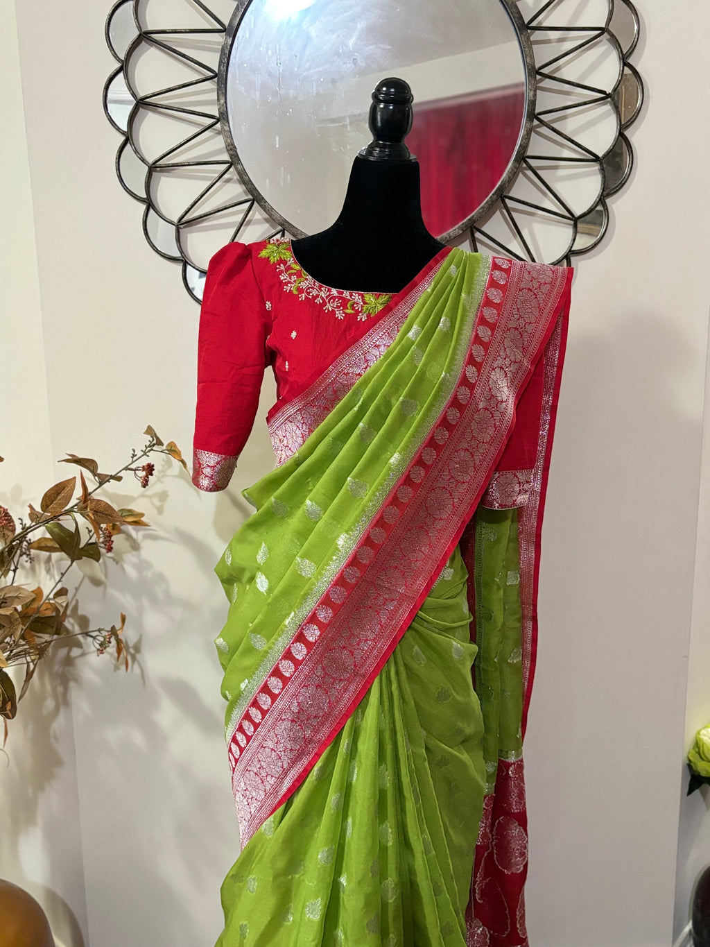 Beautiful banarasi saree paired up with pretty maggam work blouse.