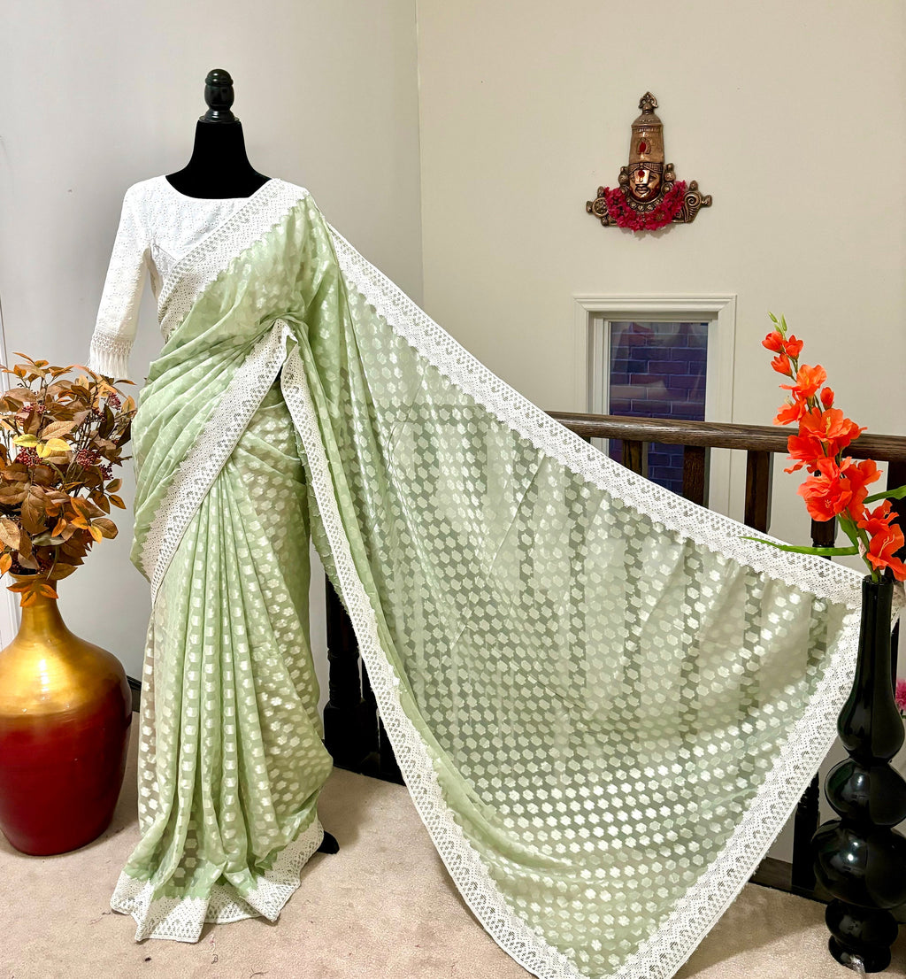 Beautiful soft falling  georgette on  sabyasachi  lace borders unique,  eye cooling pestal shades. Ready to wear designer blouse fits 32-44