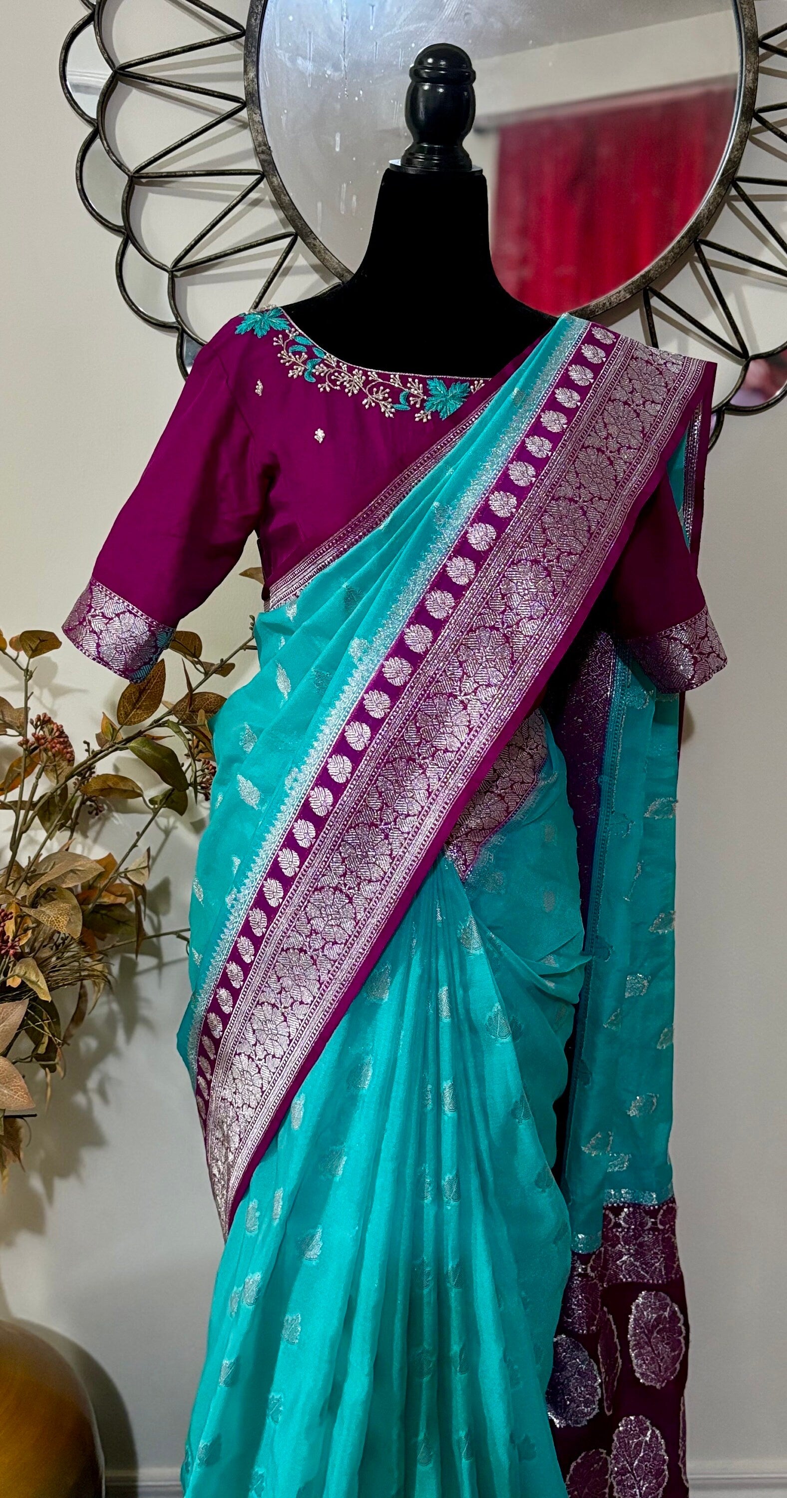Beautiful banarasi saree paired up with pretty maggam work blouse.