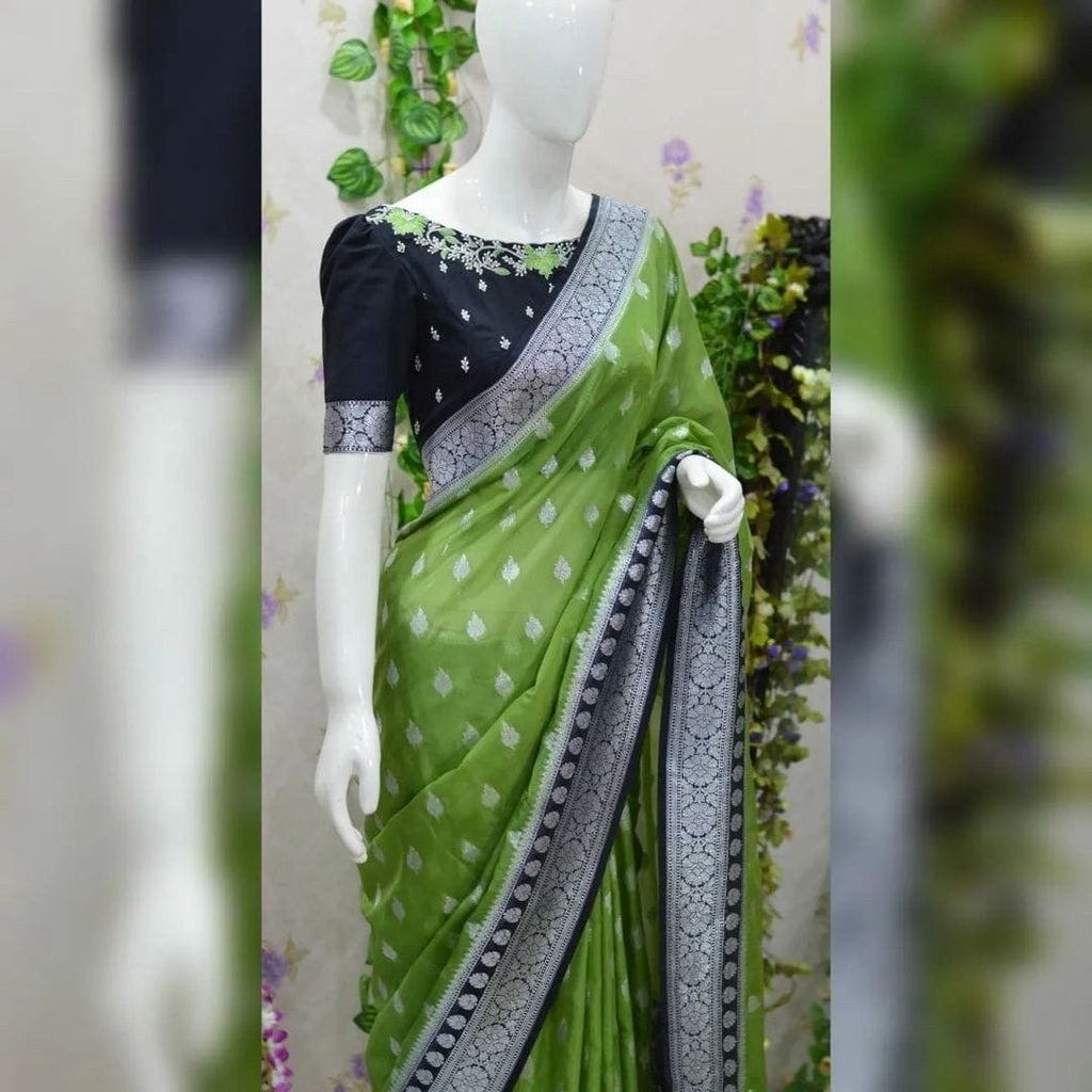Beautiful banarasi kattan saree paired up with pretty maggam work blouse.