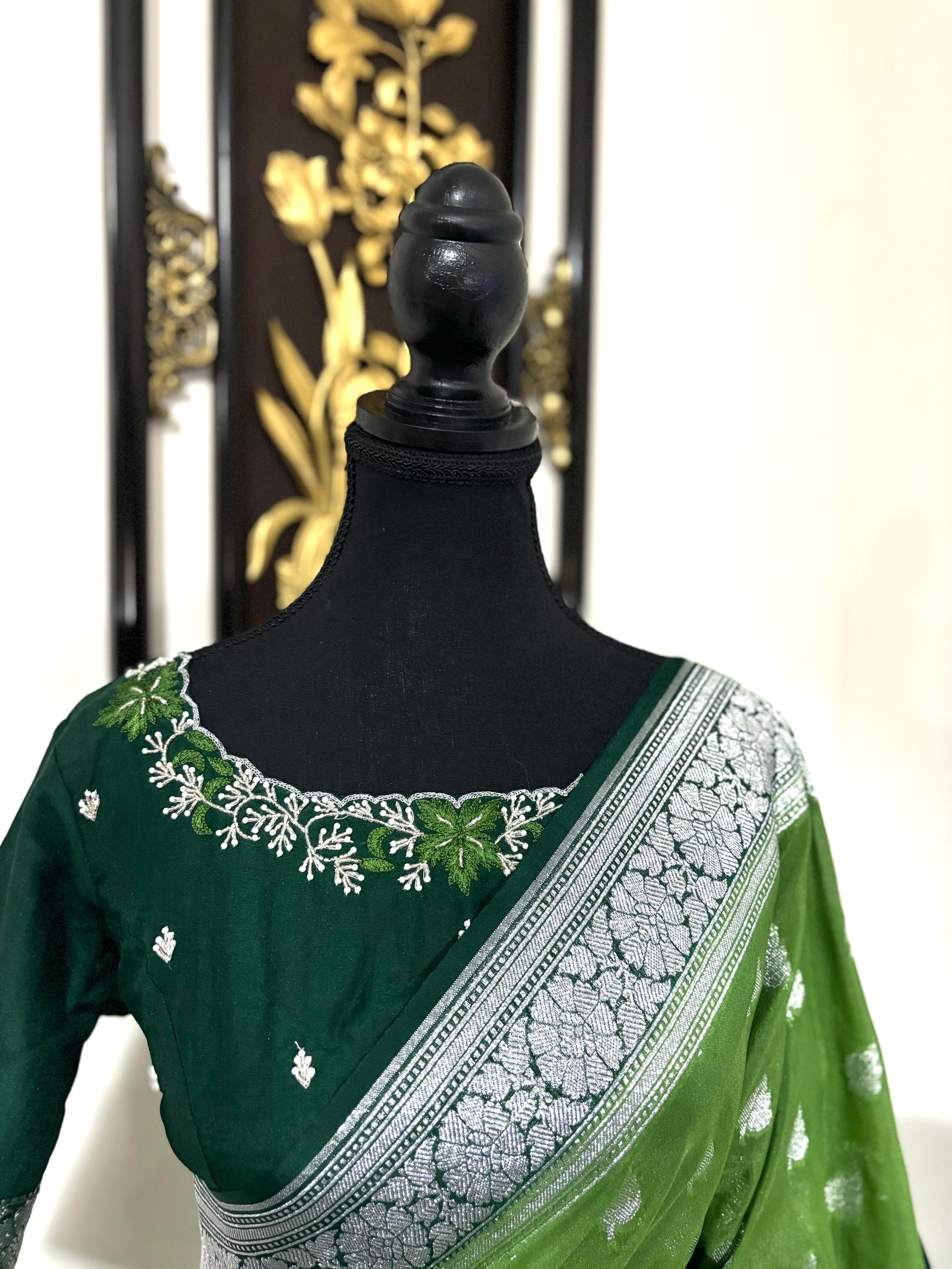 Beautiful banarasi saree paired up with pretty maggam work blouse.dits to 32-46