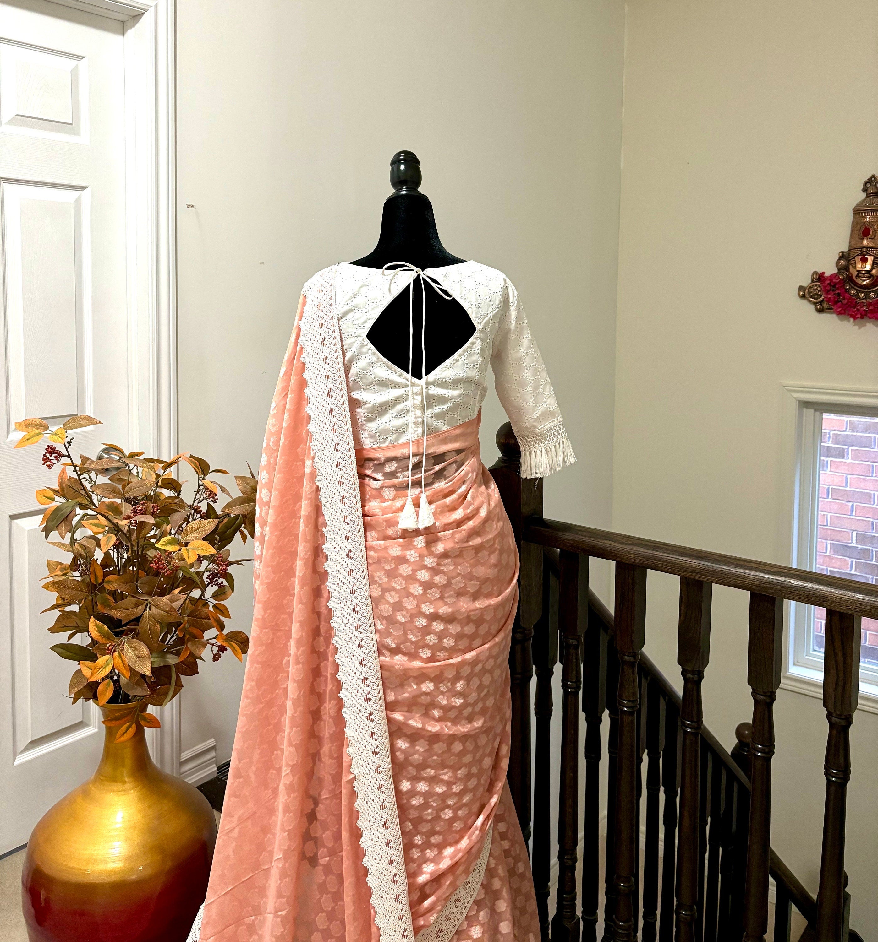 Beautiful soft falling  georgette on  sabyasachi  lace borders unique eye  cooling pestal shades. Ready to wear designer blouse fits 32-44
