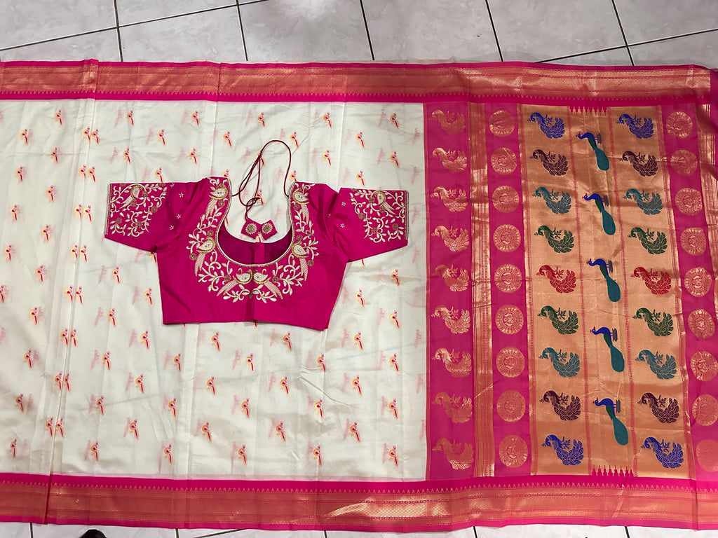 Beautiful soft white and pink paithani silk saree with all over zari weaving along with handwork on blouse