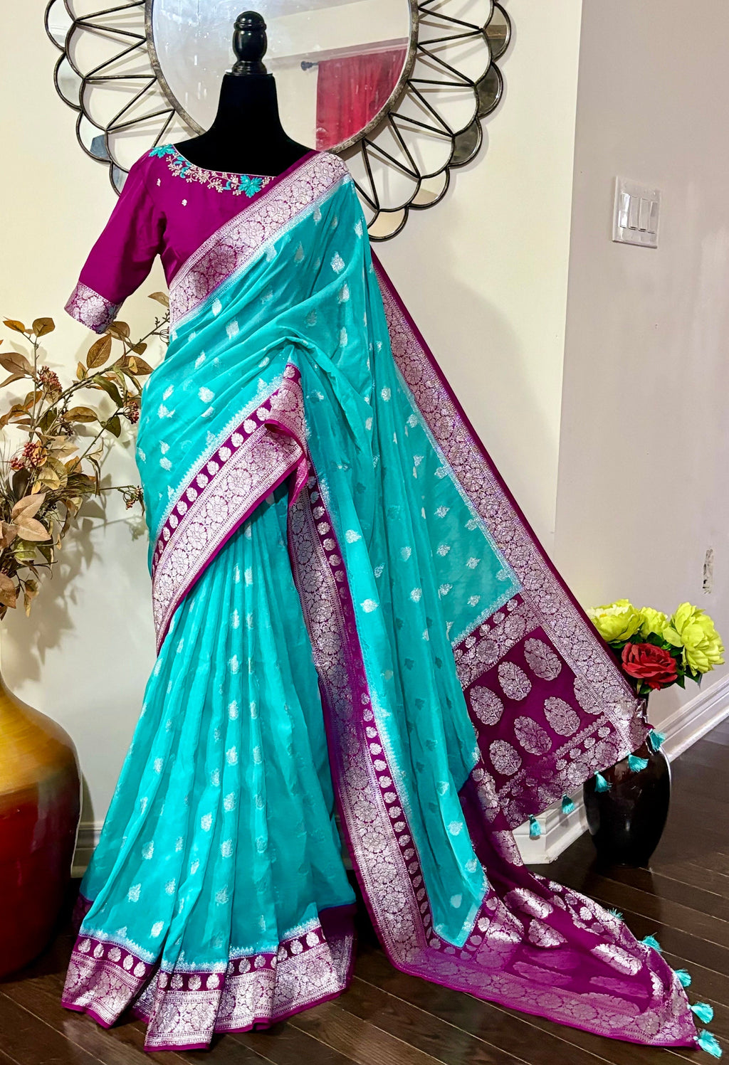 Beautiful banarasi saree paired up with pretty maggam work blouse.