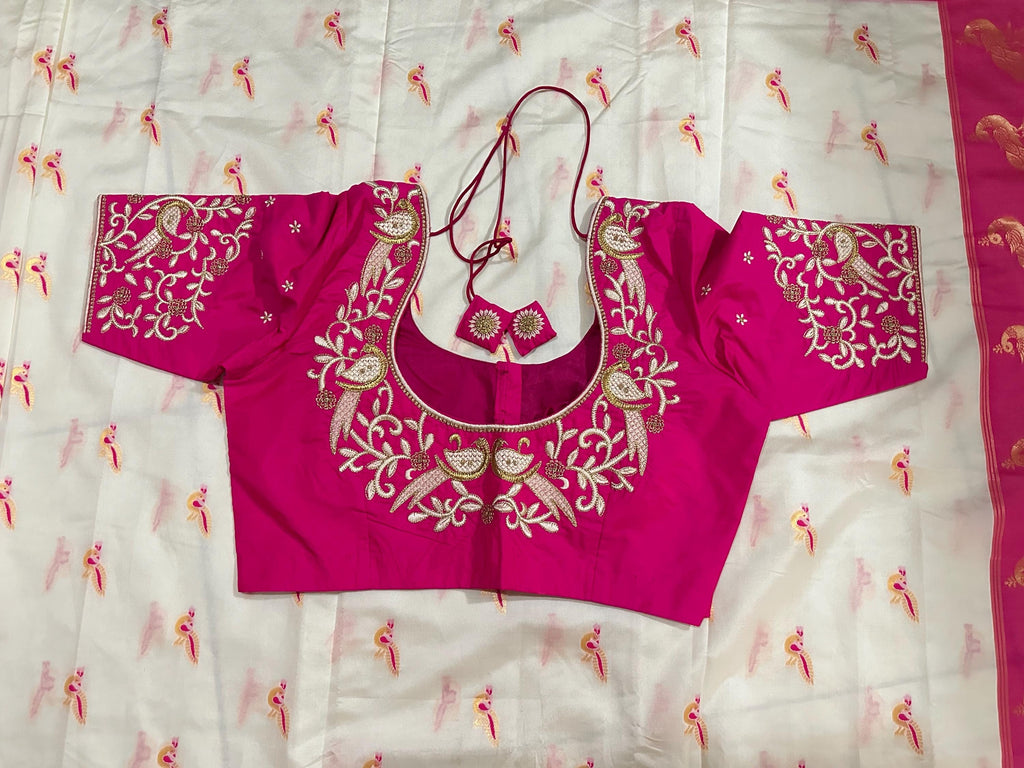Beautiful soft white and pink paithani silk saree with all over zari weaving along with handwork on blouse
