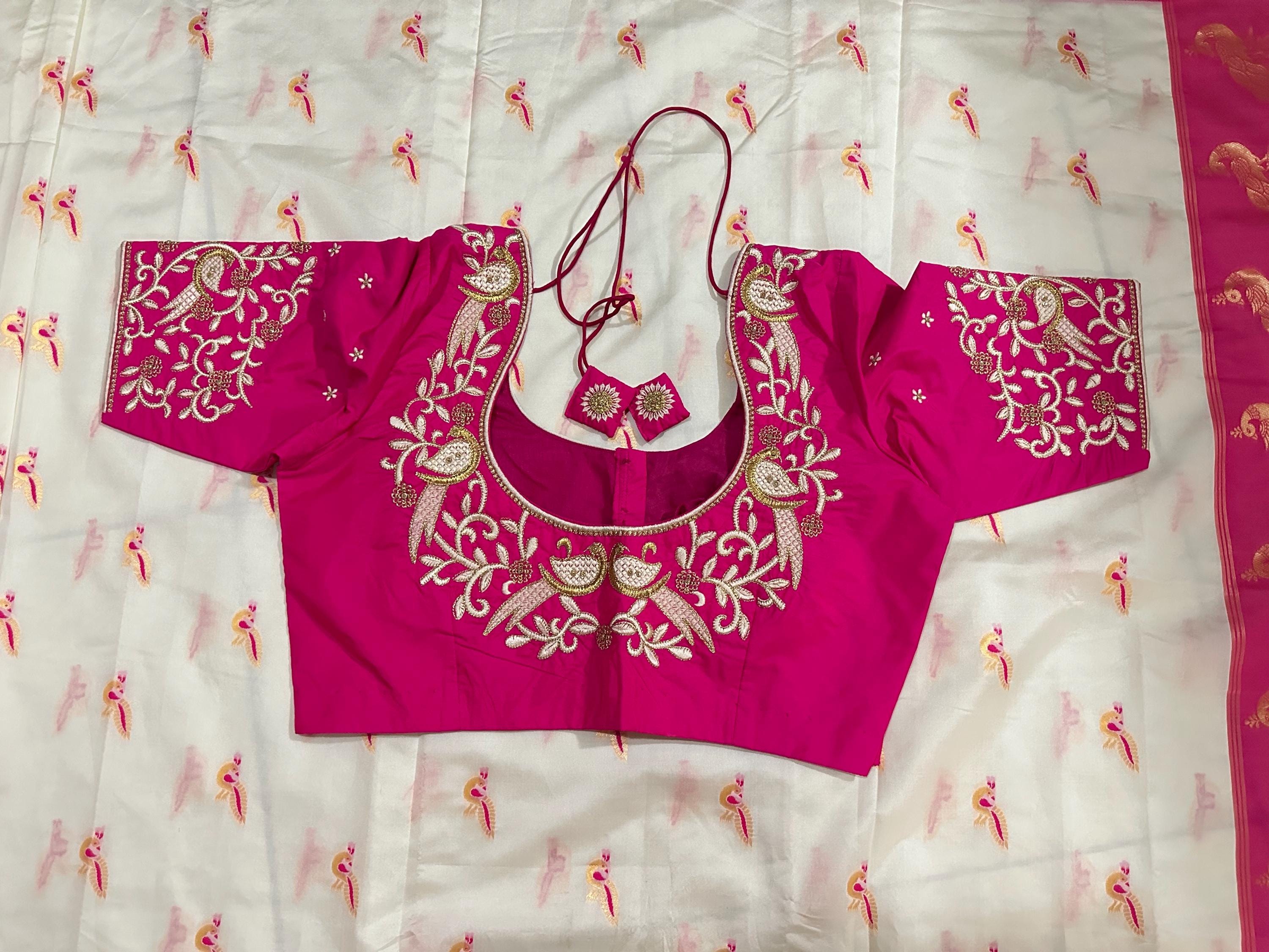 Beautiful soft white and pink paithani silk saree with all over zari weaving along with handwork on blouse