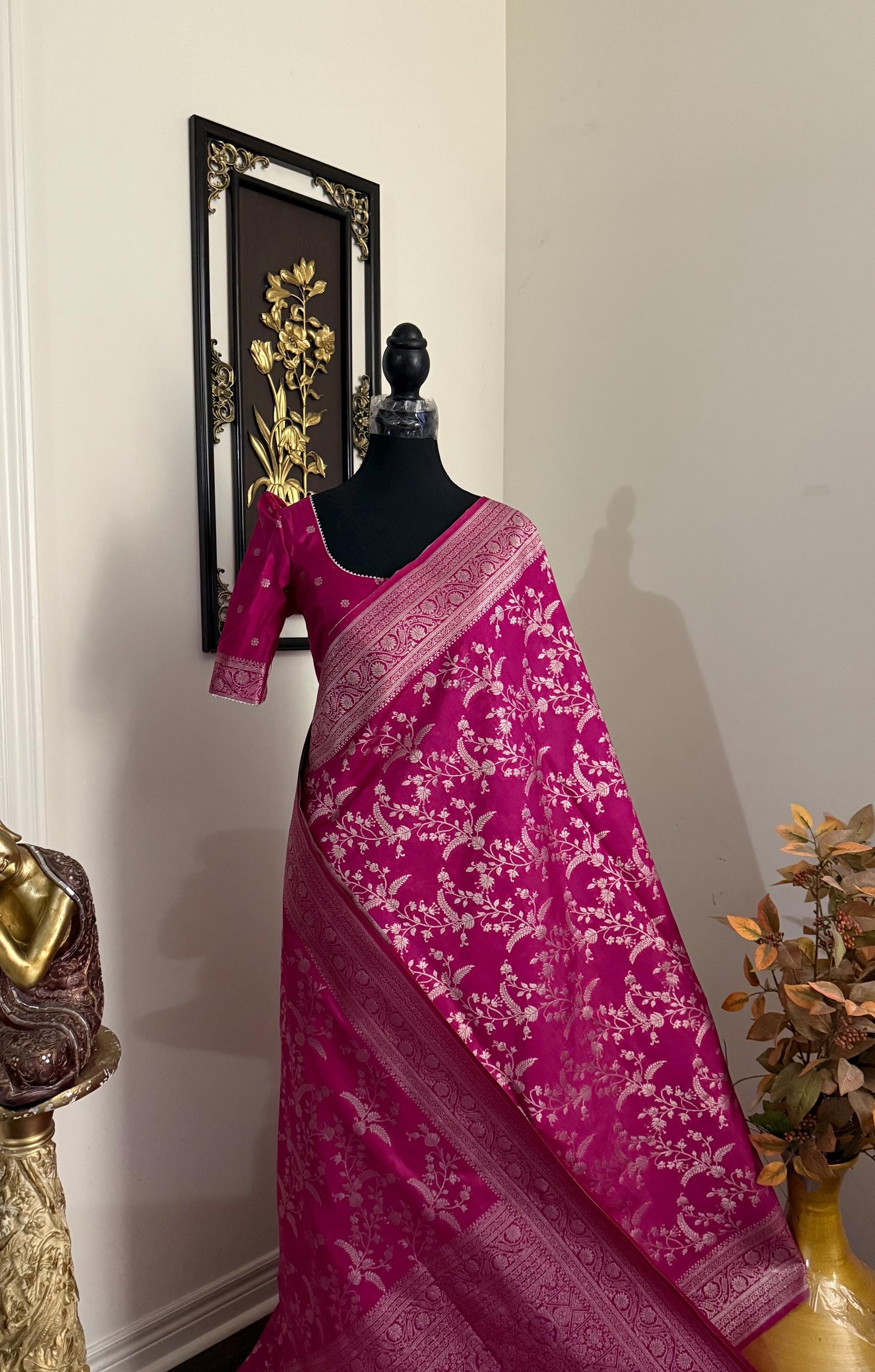 Beautiful banarasi saree with silver Zari weaving all over the saree paired up with pretty ready to wear  blouse that fits to 32 to 46