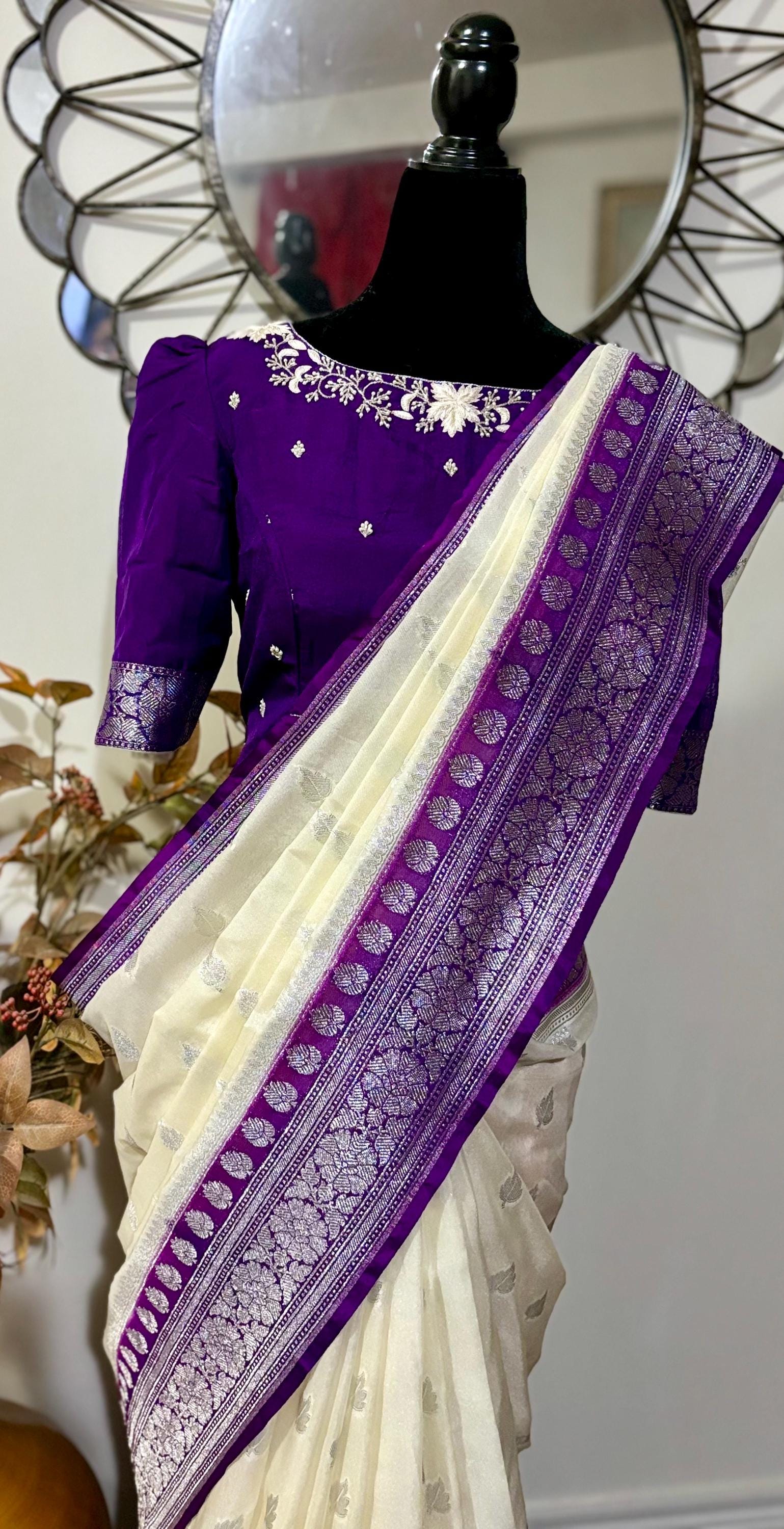 Beautiful banarasi saree paired up with pretty maggam work blouse.