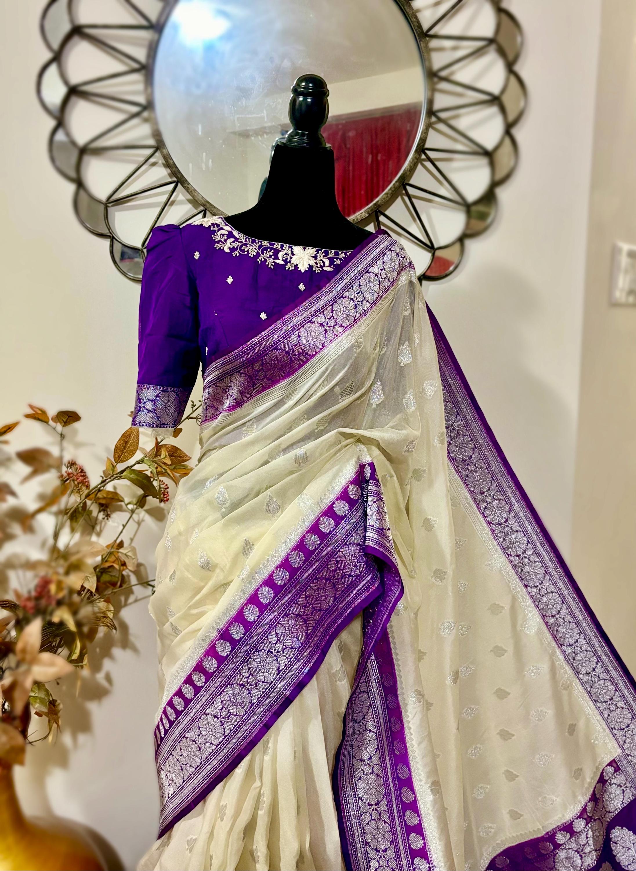 Beautiful banarasi saree paired up with pretty maggam work blouse.