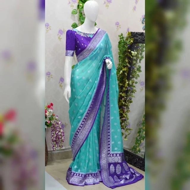 Beautiful banarasi saree paired up with pretty maggam work blouse.