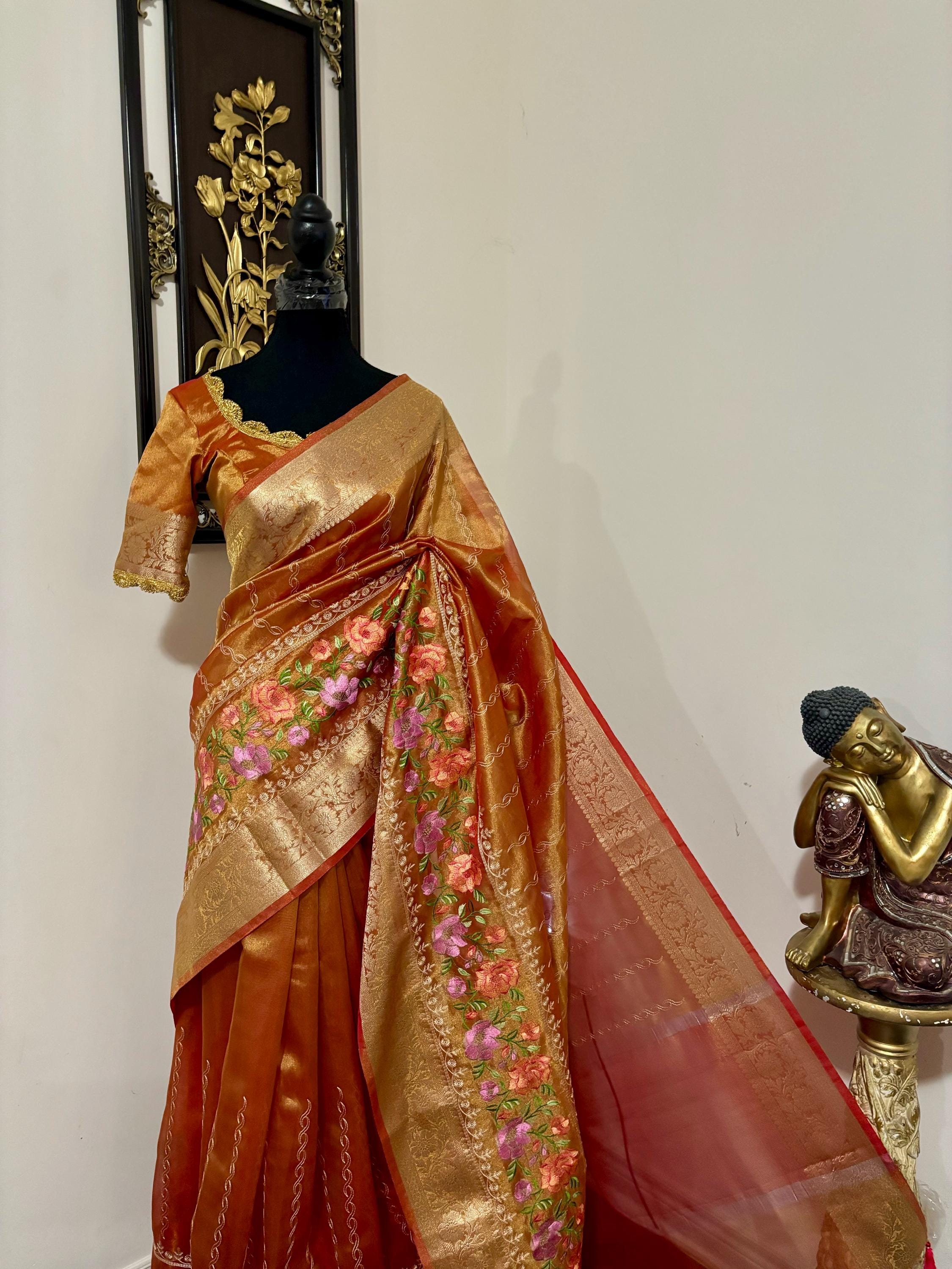 Banarasi  tissue saree with self weaving with beautifully embroidered boarder all over the sareeOrange Gold  shade rich weaving ready Blouse