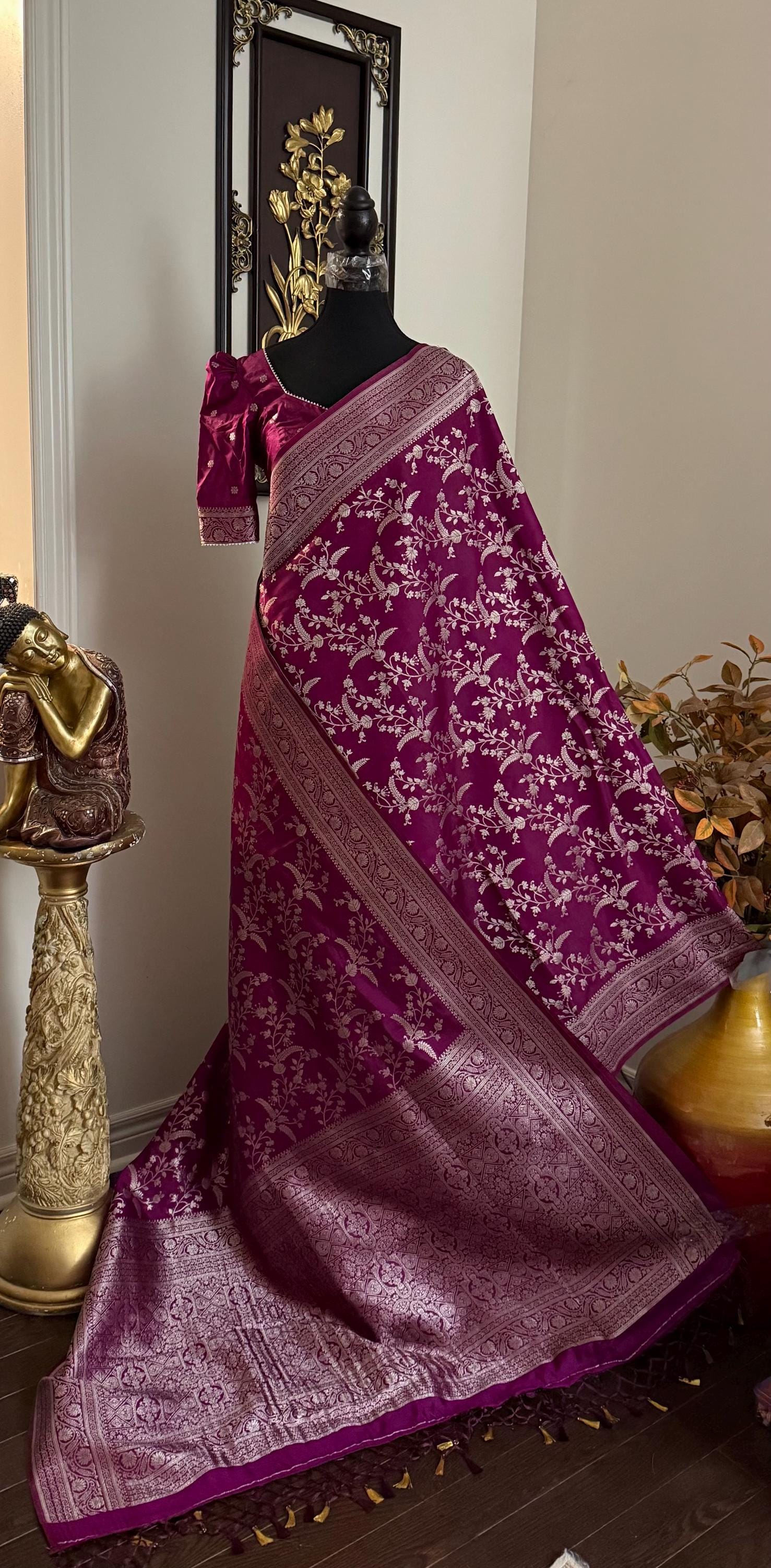 Beautiful banarasi saree with silver Zari weaving all over the saree paired up with pretty ready to wear  blouse that fits to 32 to 46