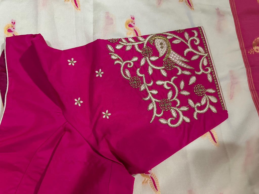 Beautiful soft white and pink paithani silk saree with all over zari weaving along with handwork on blouse