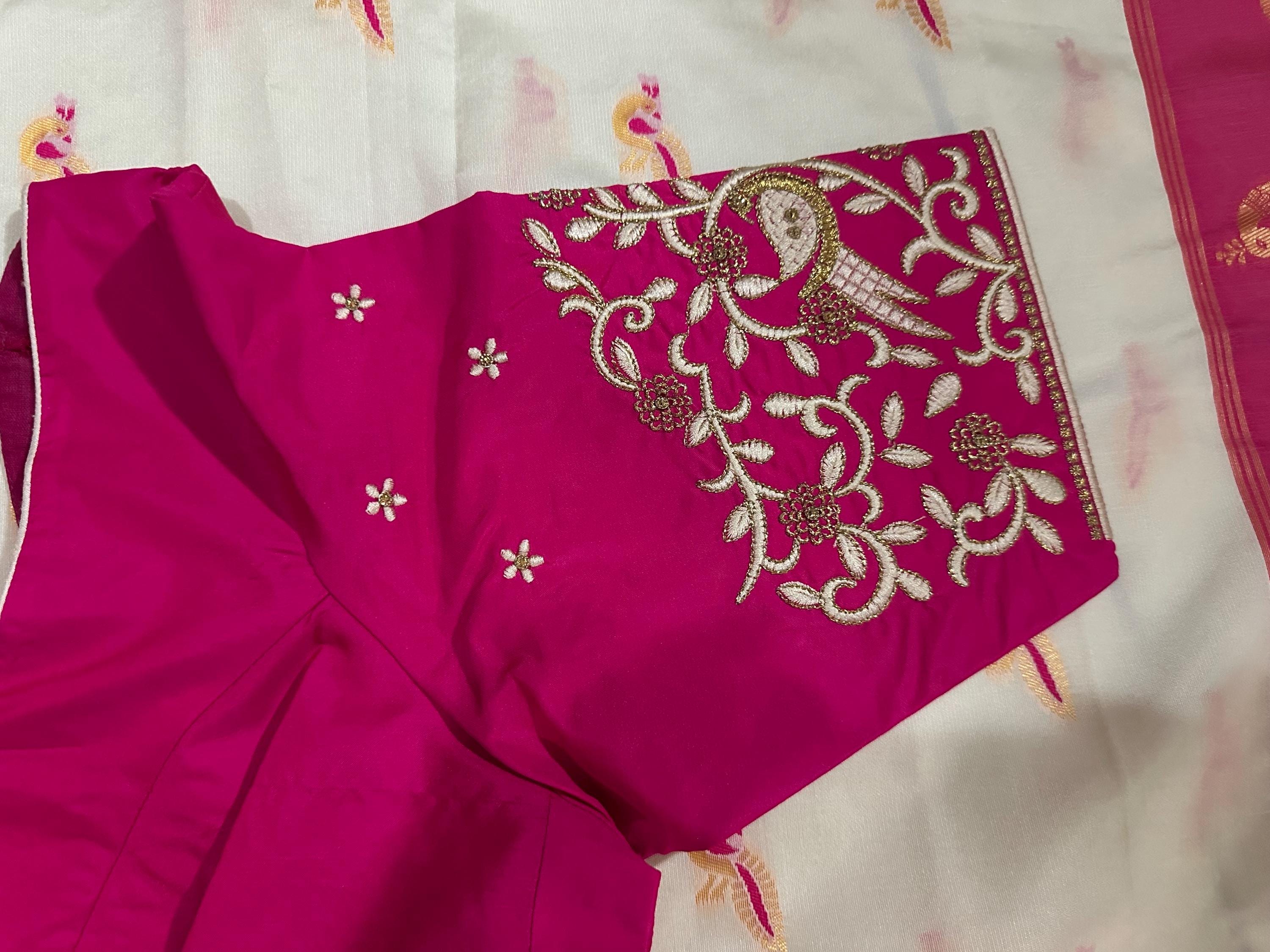 Beautiful soft white and pink paithani silk saree with all over zari weaving along with handwork on blouse