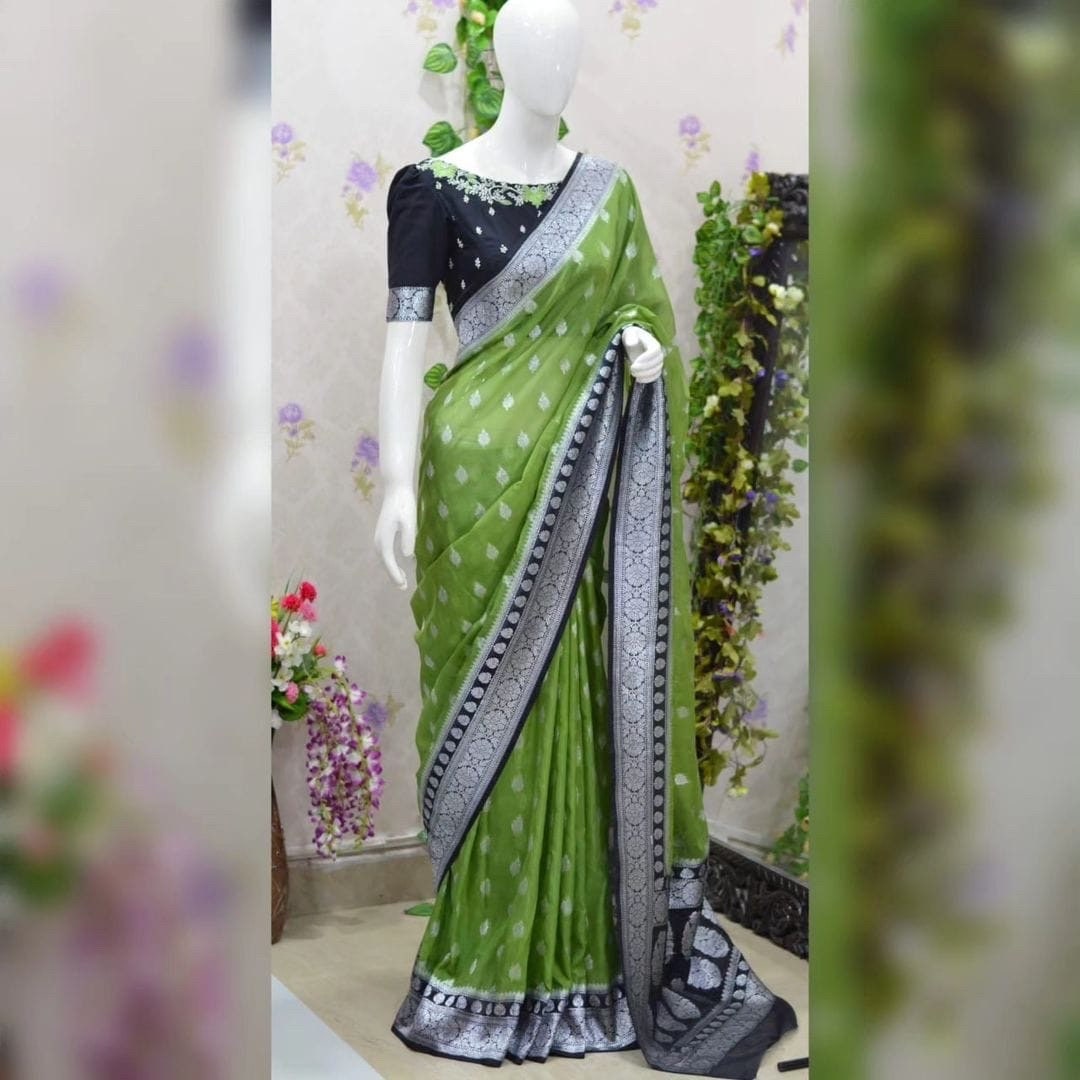 Beautiful banarasi kattan saree paired up with pretty maggam work blouse.