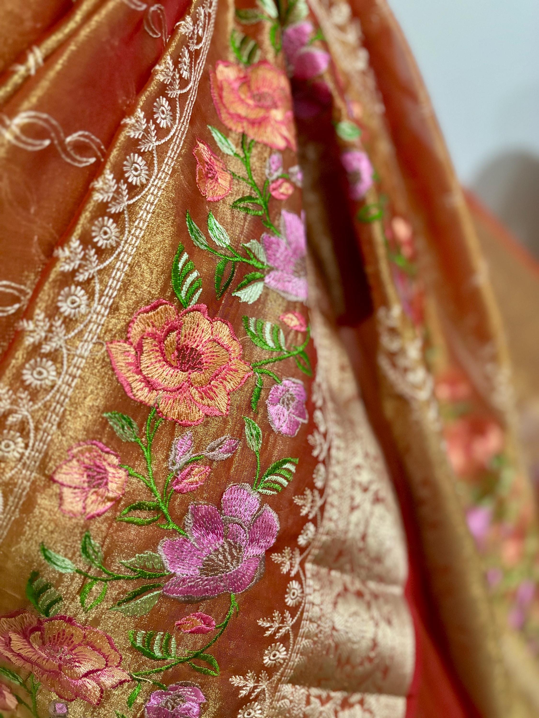 Banarasi  tissue saree with self weaving with beautifully embroidered boarder all over the sareeOrange Gold  shade rich weaving ready Blouse