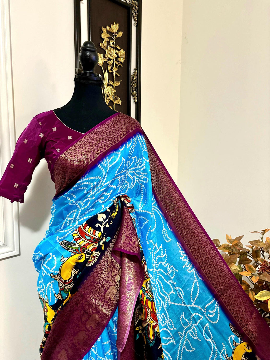 Beautiful pure silk bandini silk saree paired up pretty blouse sizes 32 -46 ready to wear.With Zari boarders elephant prints and peacocks
