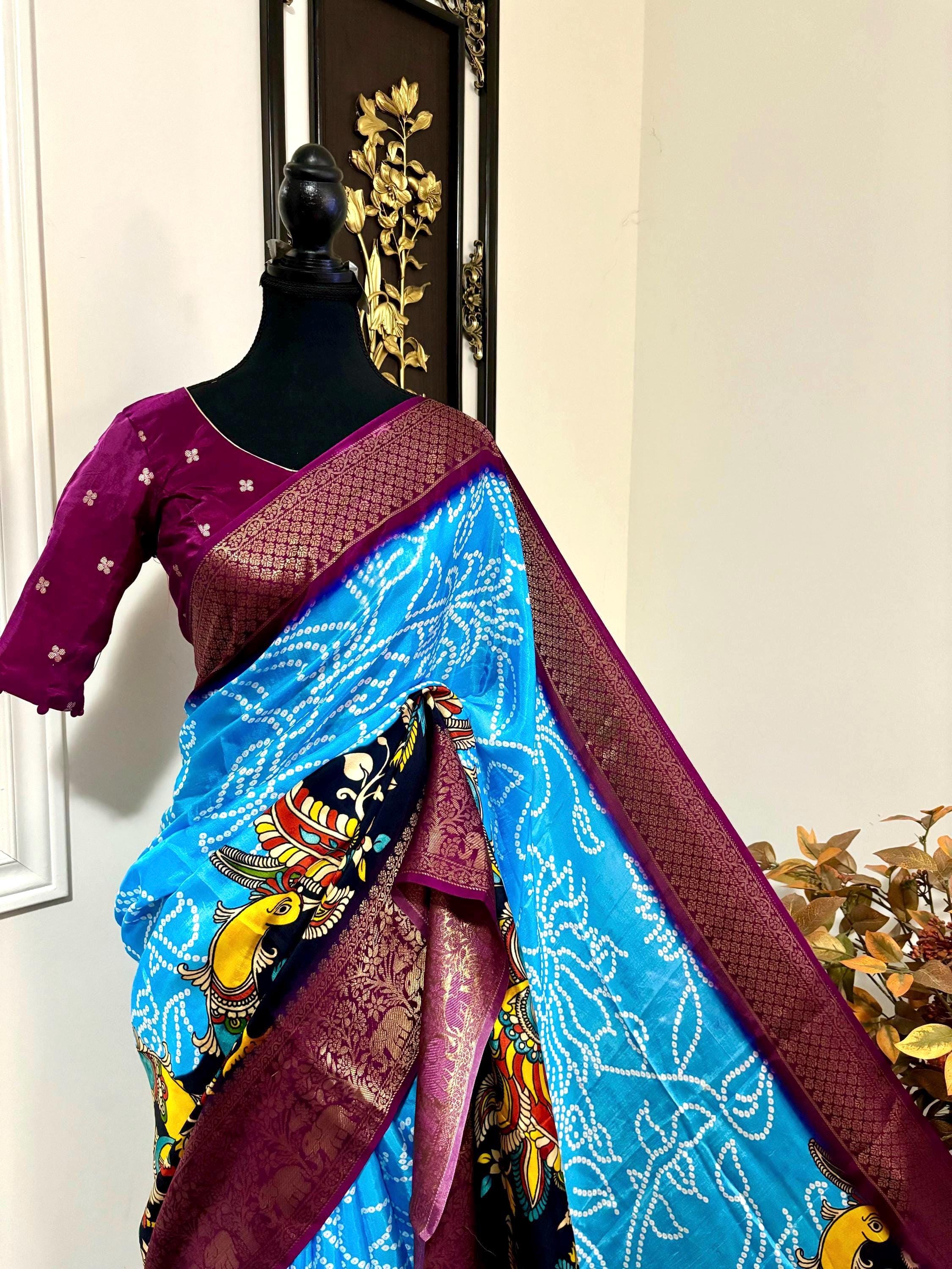 Beautiful pure silk bandini silk saree paired up pretty blouse sizes 32 -46 ready to wear.With Zari boarders elephant prints and peacocks