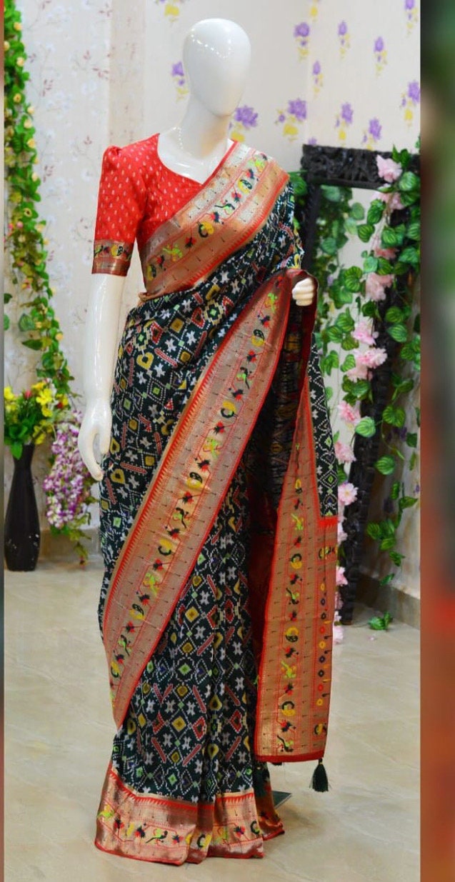 Beautiful patola paithani saree paired up with pretty banaras weaving blouse