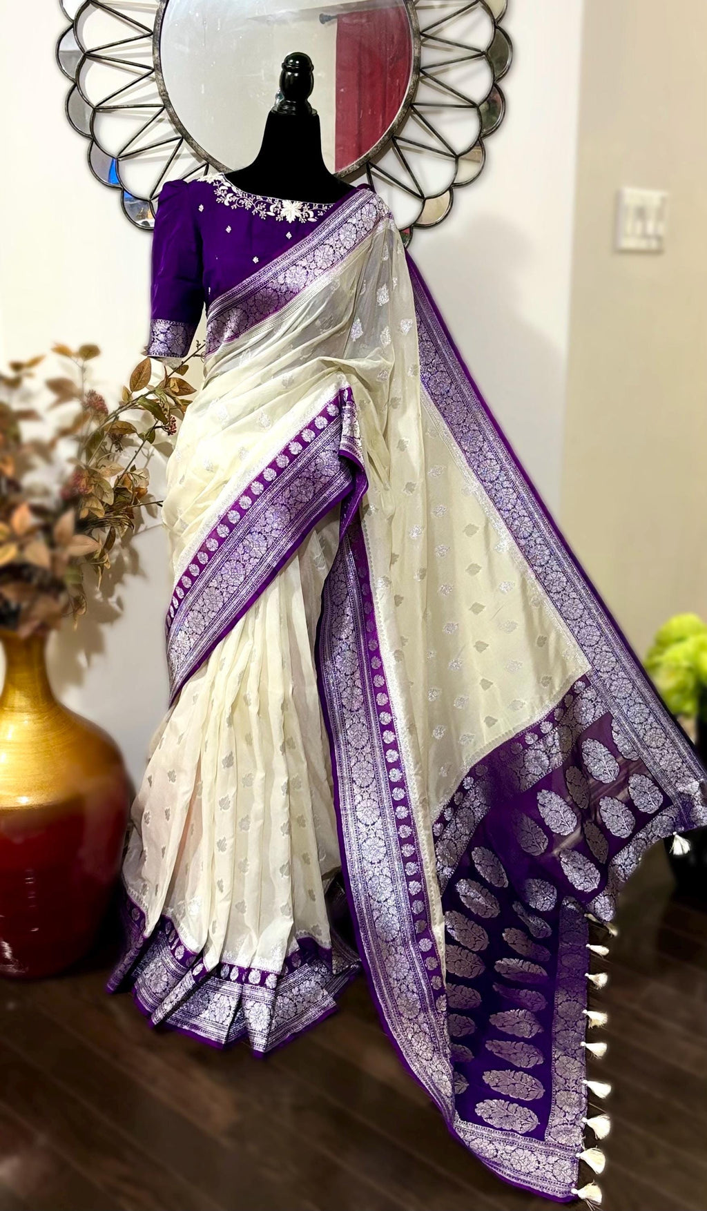 Beautiful banarasi saree paired up with pretty maggam work blouse.