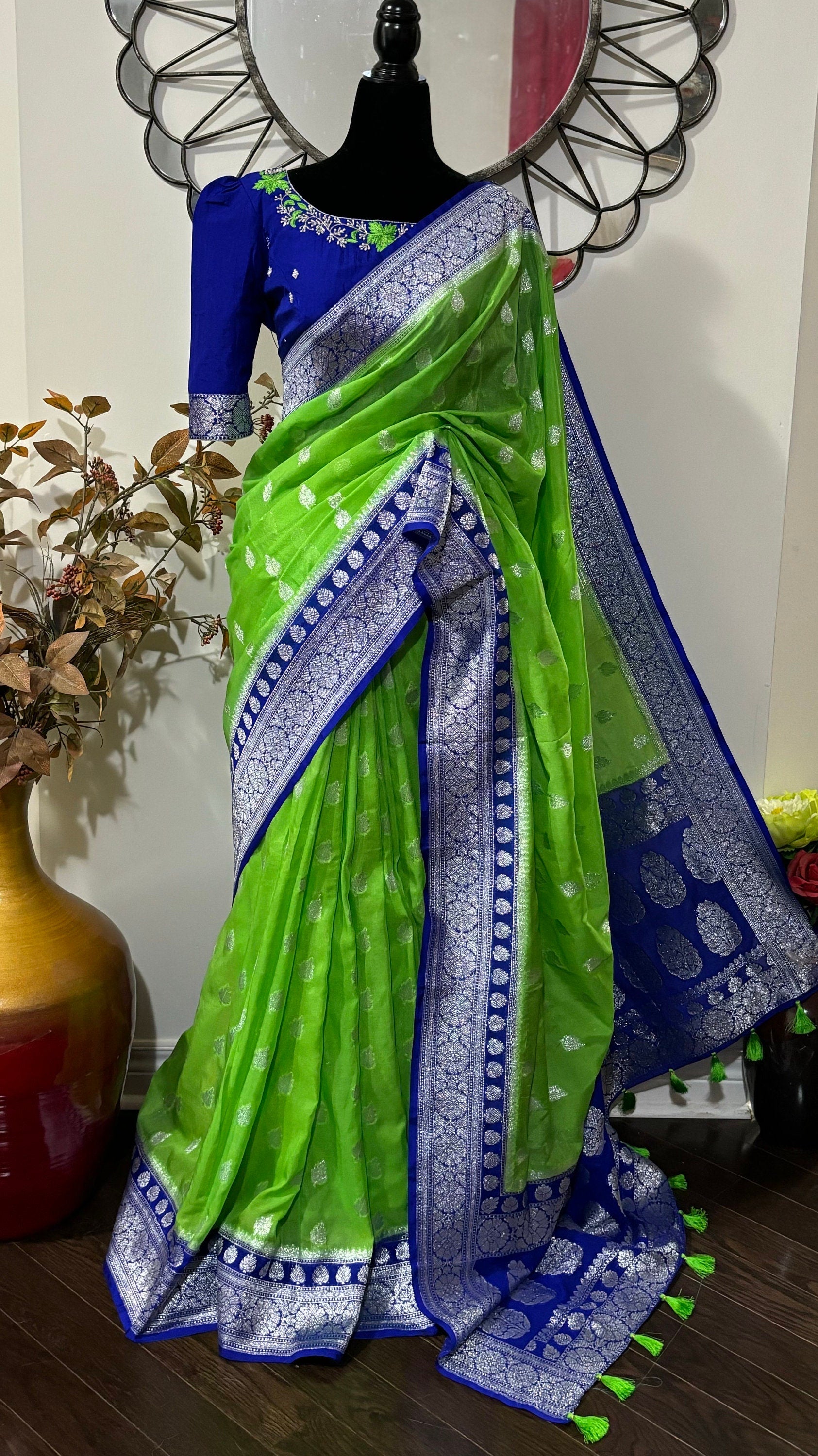 Beautiful banarasi kattan saree paired up with pretty maggam work blouse.