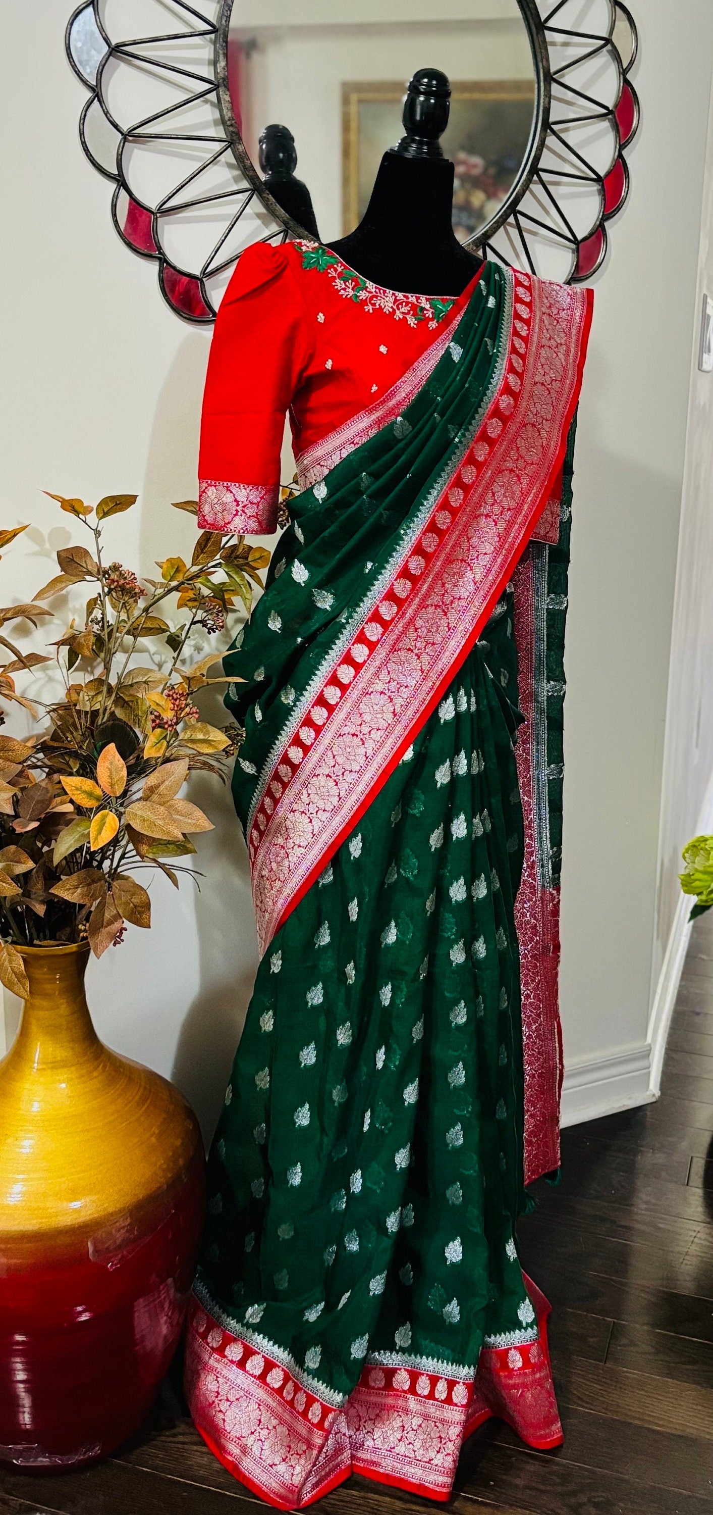 Beautiful banarasi kattan saree paired up with pretty maggam work blouse.