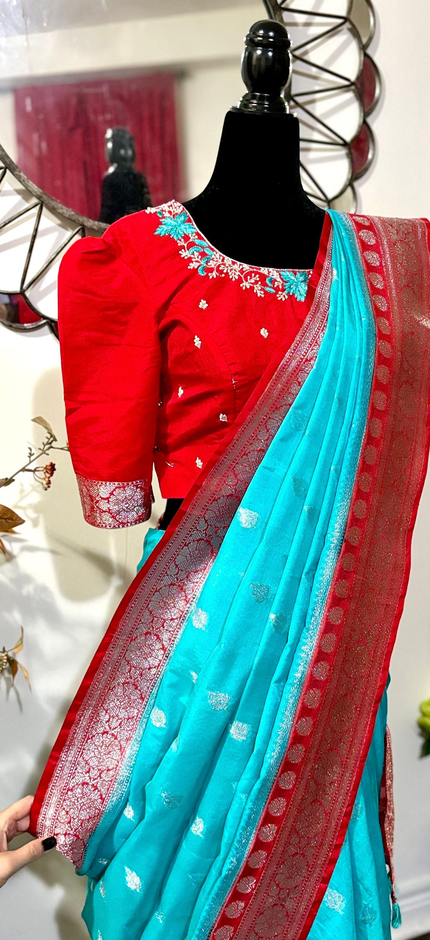 Beautiful banarasi saree paired up with pretty maggam work blouse.