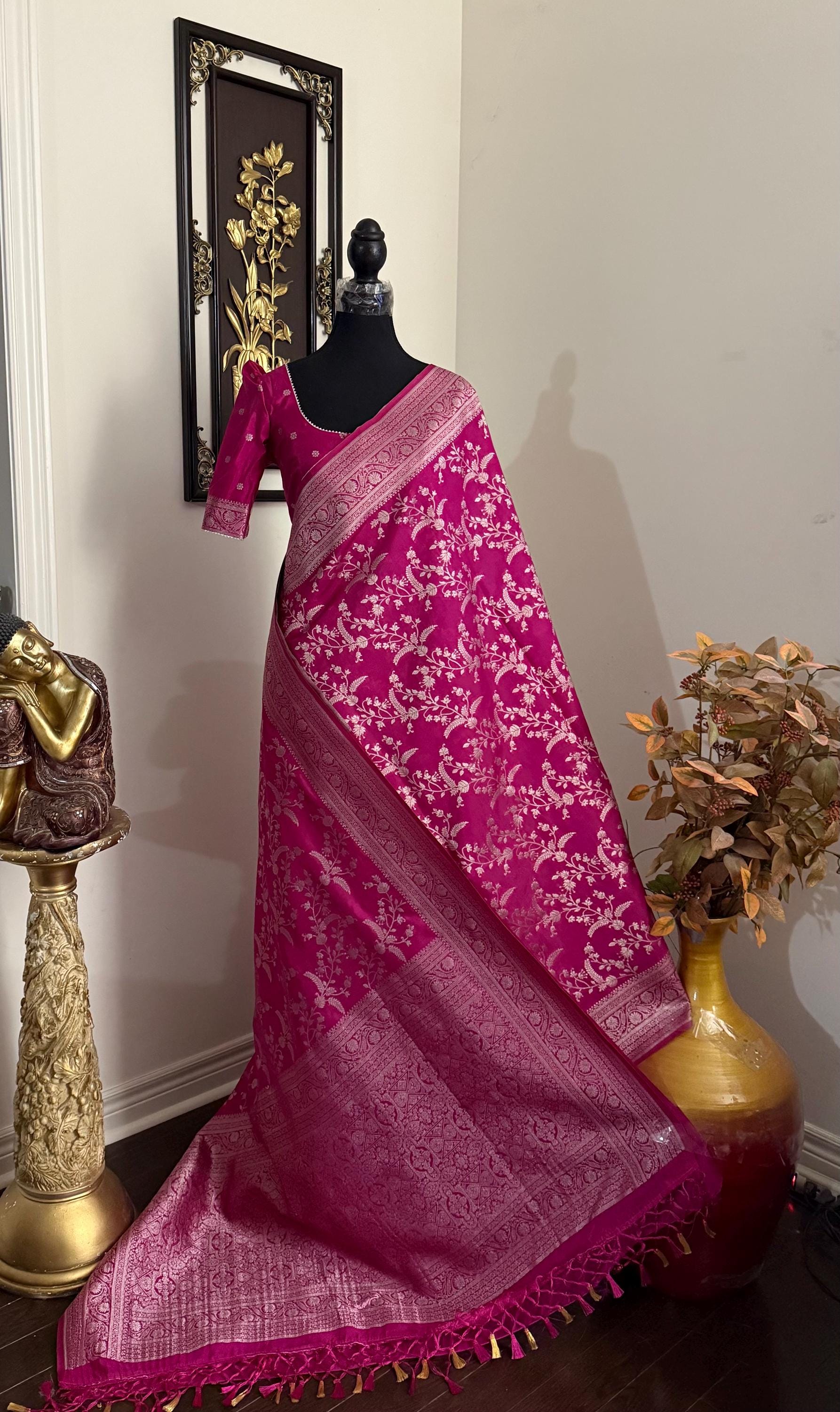 Beautiful banarasi saree with silver Zari weaving all over the saree paired up with pretty ready to wear  blouse that fits to 32 to 46