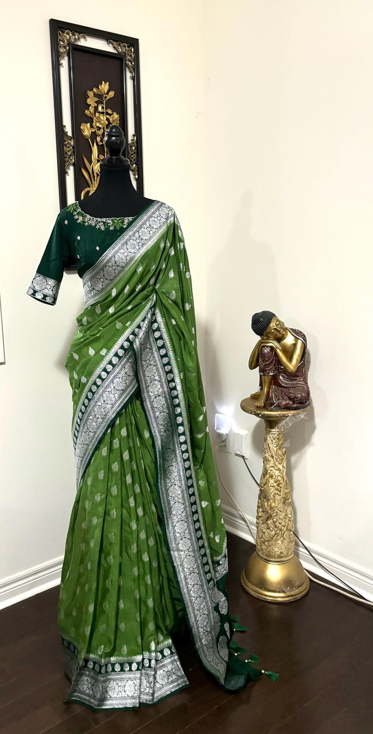 Beautiful banarasi saree paired up with pretty maggam work blouse.dits to 32-46