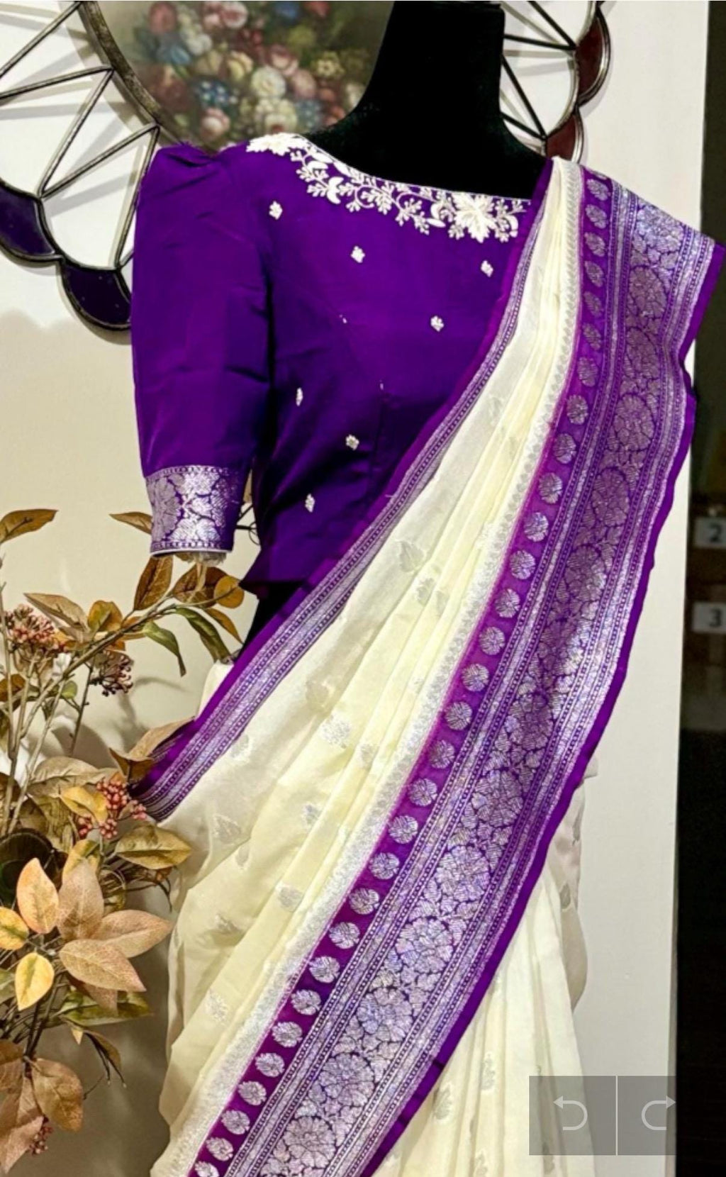 Beautiful banarasi saree paired up with pretty maggam work blouse.