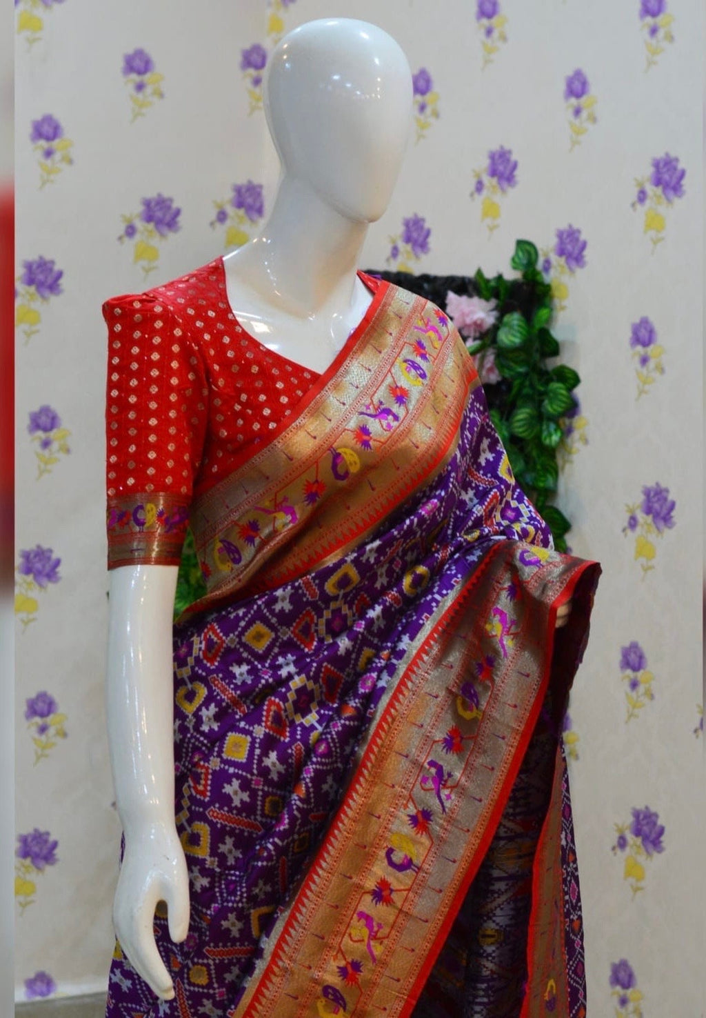 Beautiful patola paithani saree paired up with pretty banaras weaving blouse