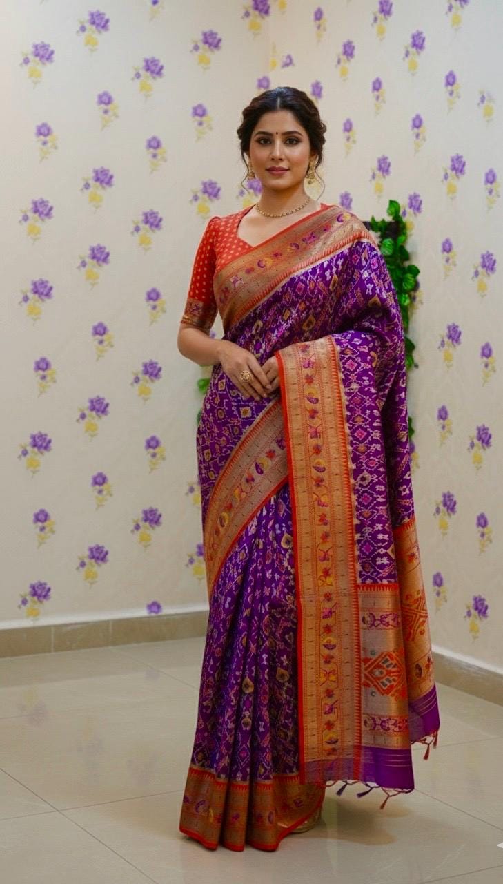 Beautiful patola paithani saree paired up with pretty banaras weaving blouse