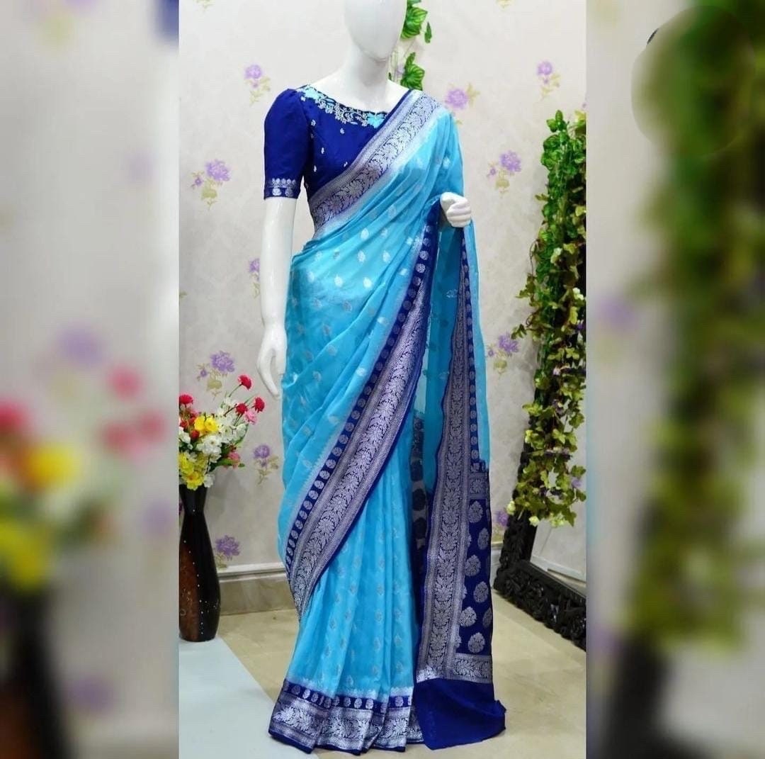 Beautiful banarasi saree paired up with pretty maggam work blouse.