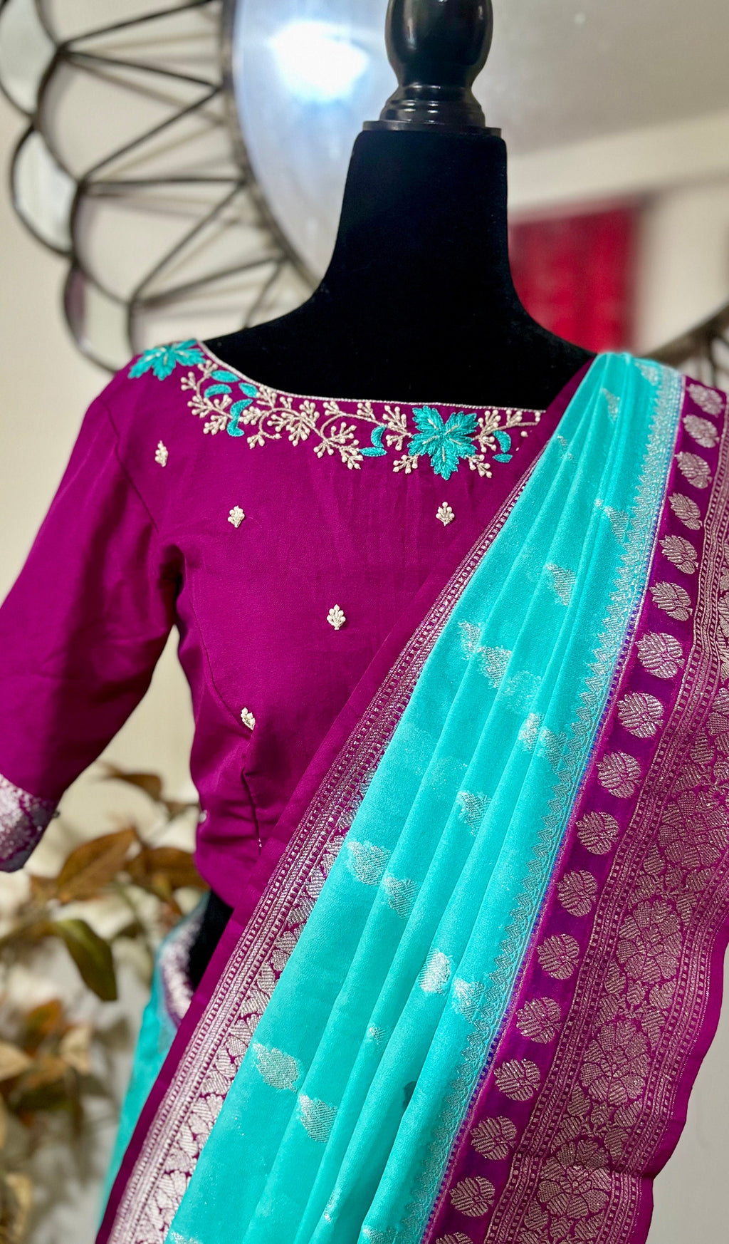 Beautiful banarasi saree paired up with pretty maggam work blouse.