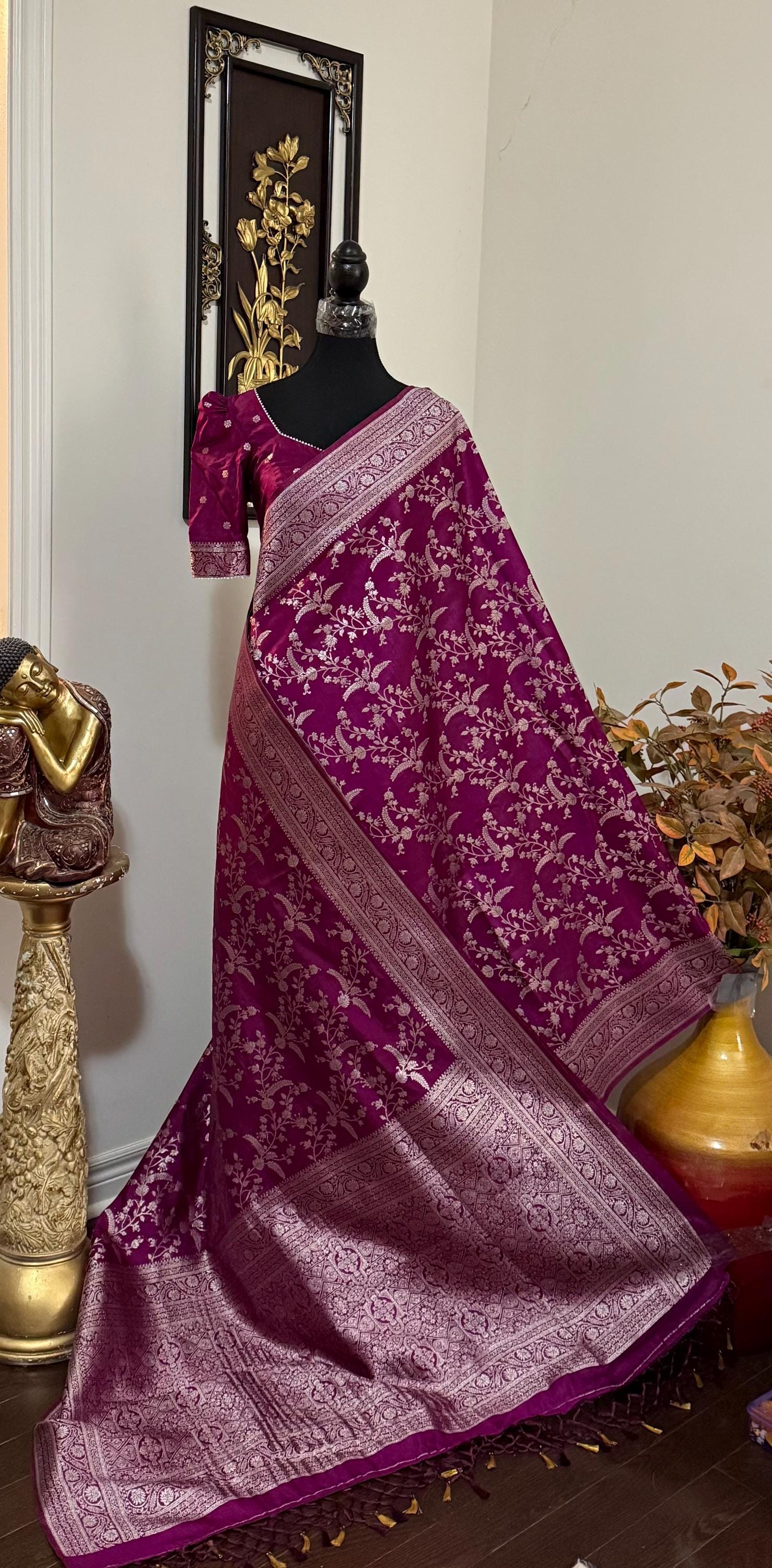 Beautiful banarasi saree with silver Zari weaving all over the saree paired up with pretty ready to wear  blouse that fits to 32 to 46