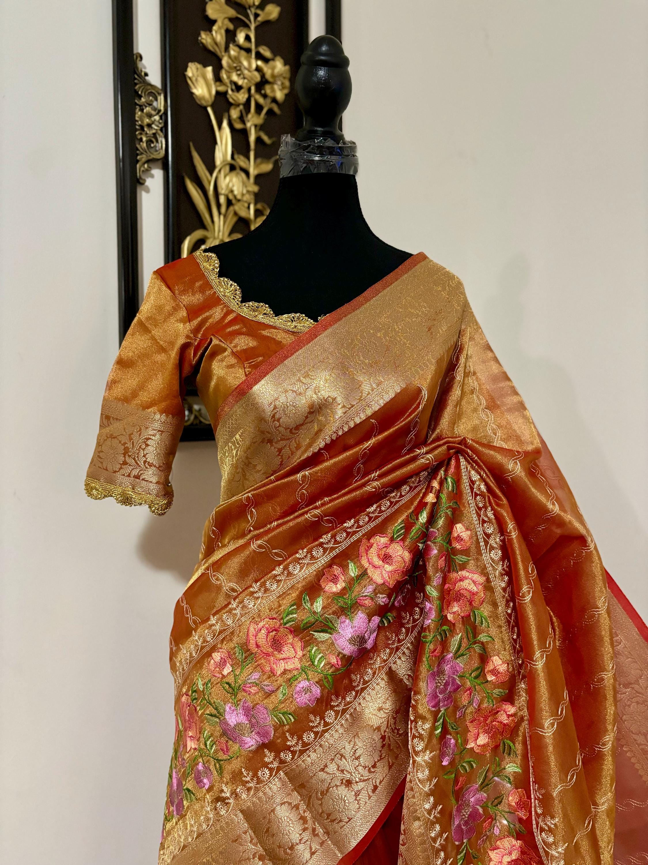 Banarasi  tissue saree with self weaving with beautifully embroidered boarder all over the sareeOrange Gold  shade rich weaving ready Blouse
