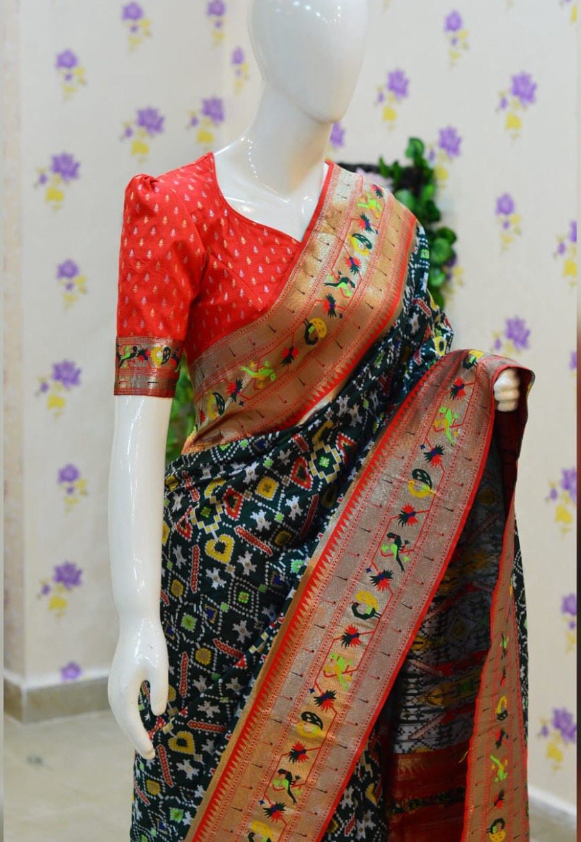 Beautiful patola paithani saree paired up with pretty banaras weaving blouse