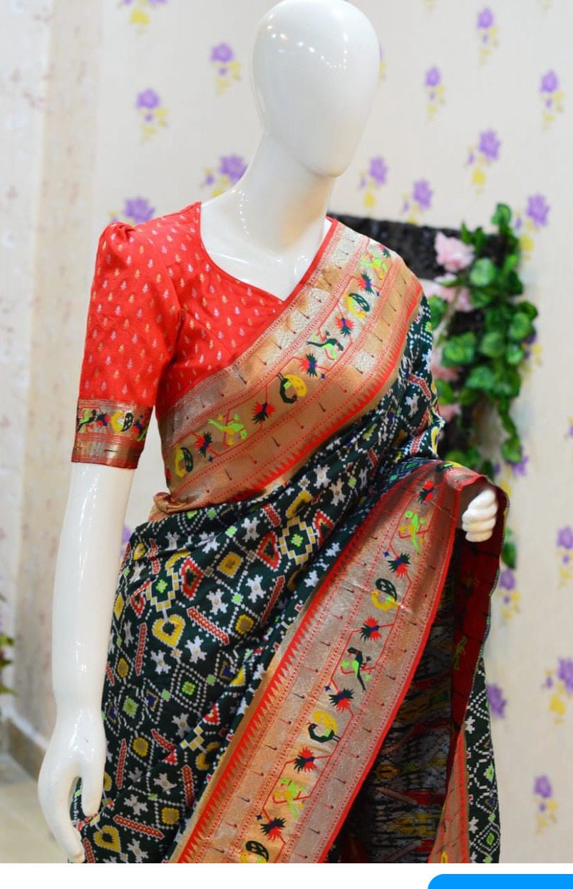 Beautiful patola paithani saree paired up with pretty banaras weaving blouse