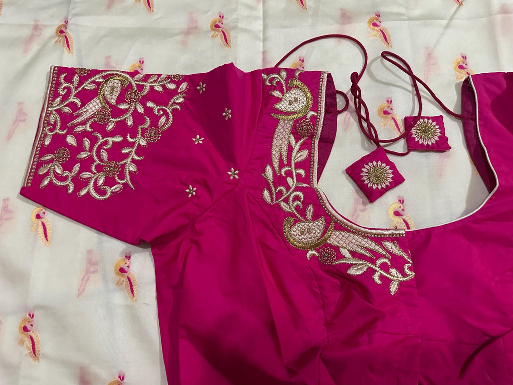 Beautiful soft white and pink paithani silk saree with all over zari weaving along with handwork on blouse