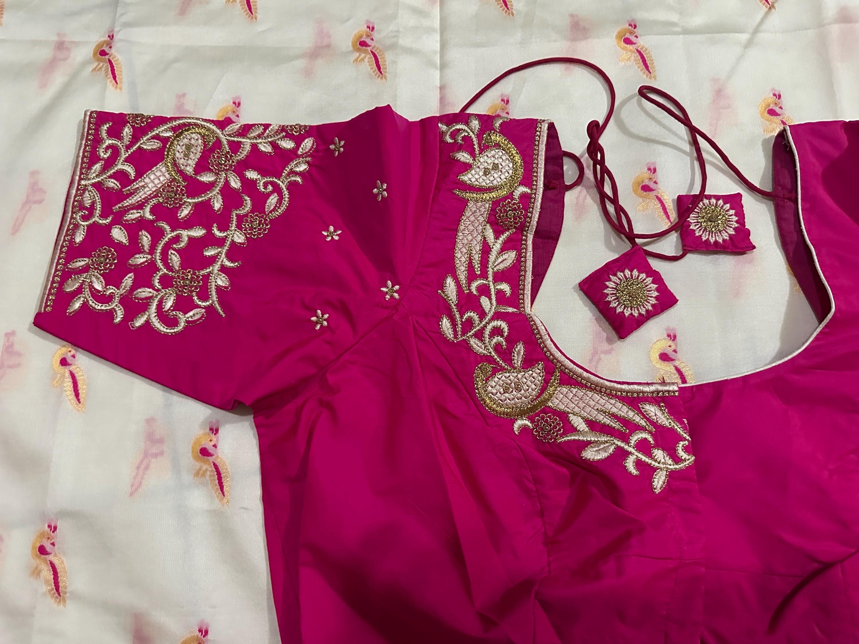 Beautiful soft white and pink paithani silk saree with all over zari weaving along with handwork on blouse