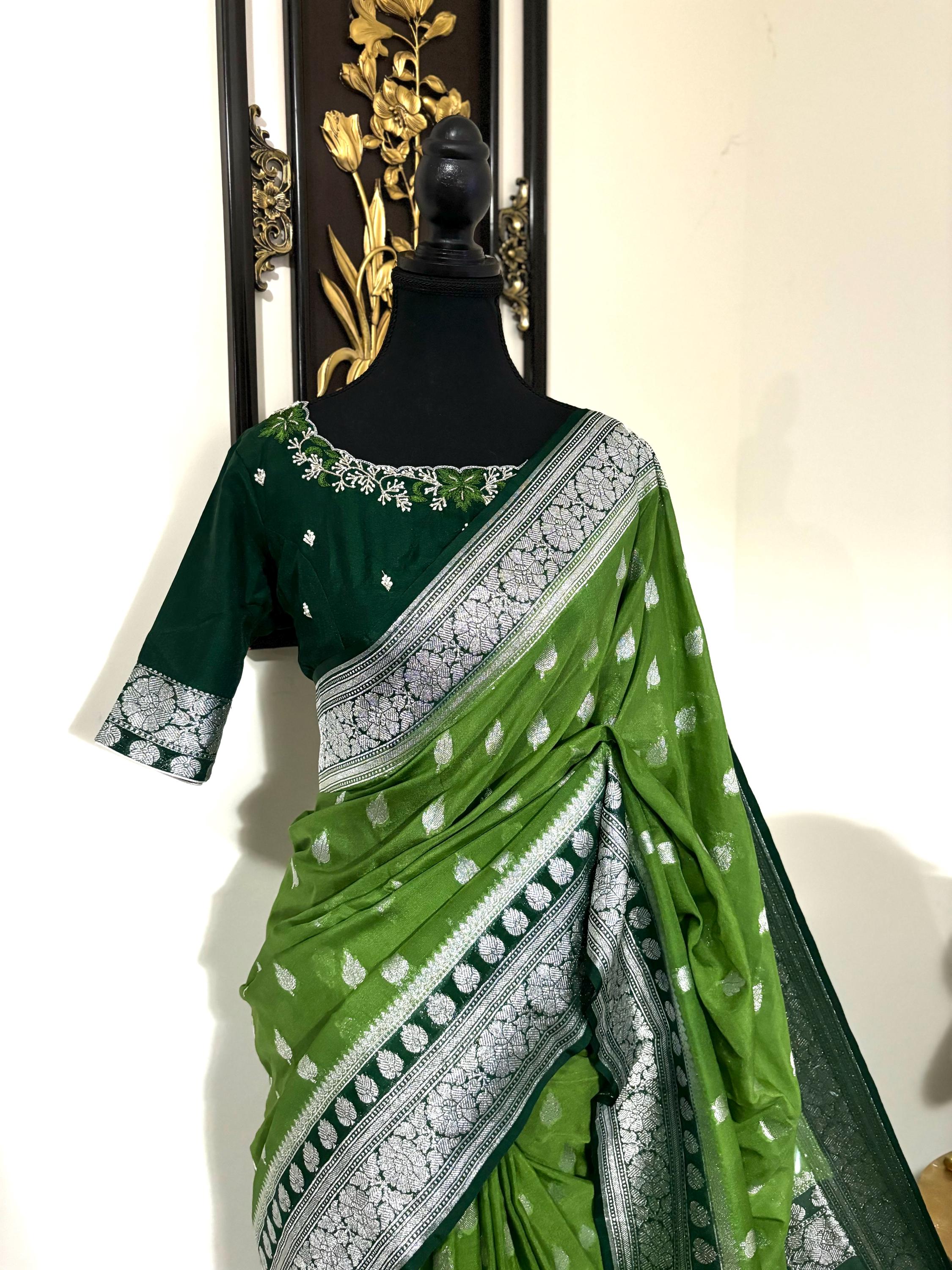 Beautiful banarasi saree paired up with pretty maggam work blouse.dits to 32-46