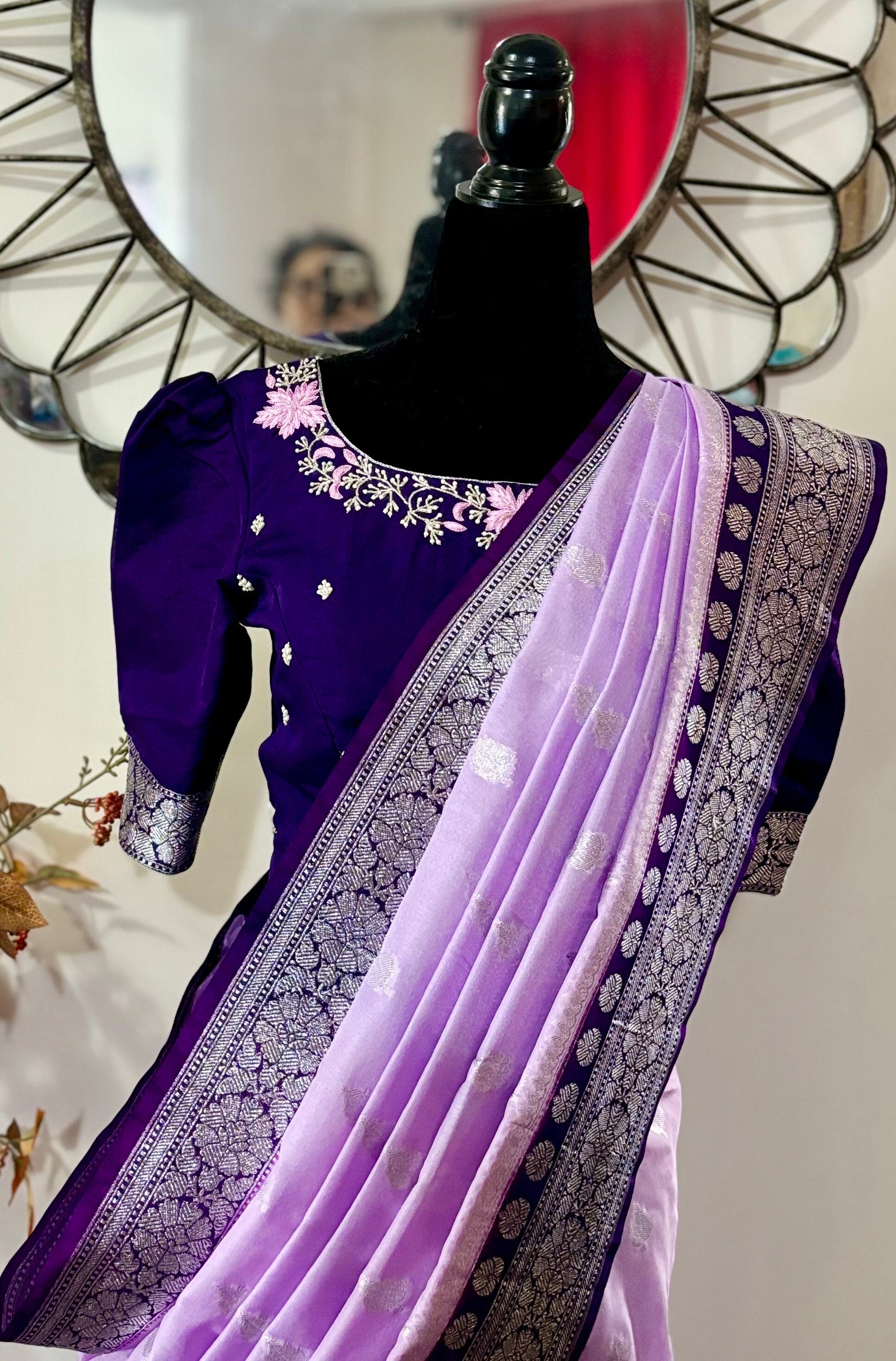 Beautiful banarasi saree paired up with pretty maggam work blouse.