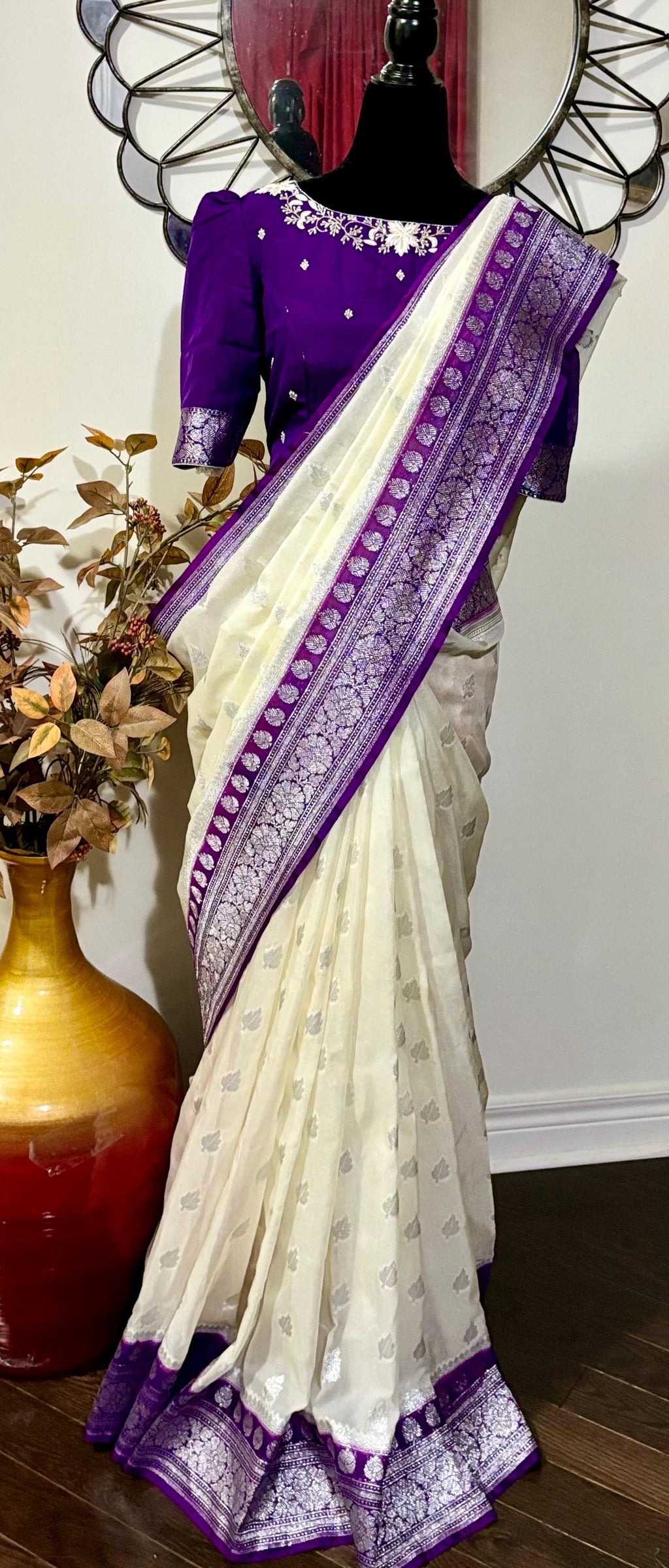 Beautiful banarasi saree paired up with pretty maggam work blouse.