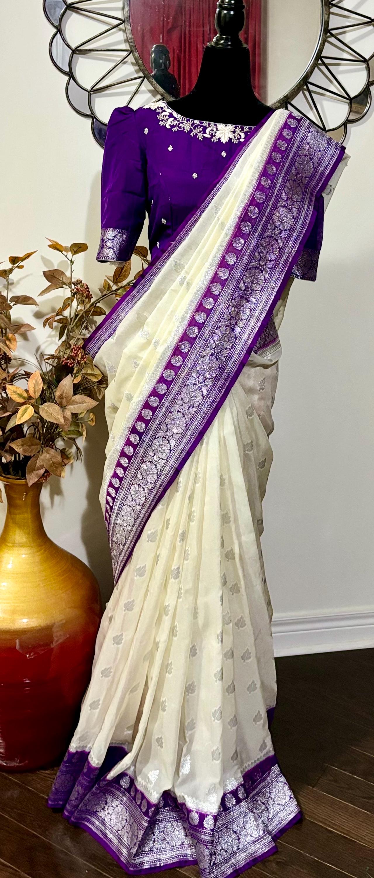 Beautiful banarasi saree paired up with pretty maggam work blouse.