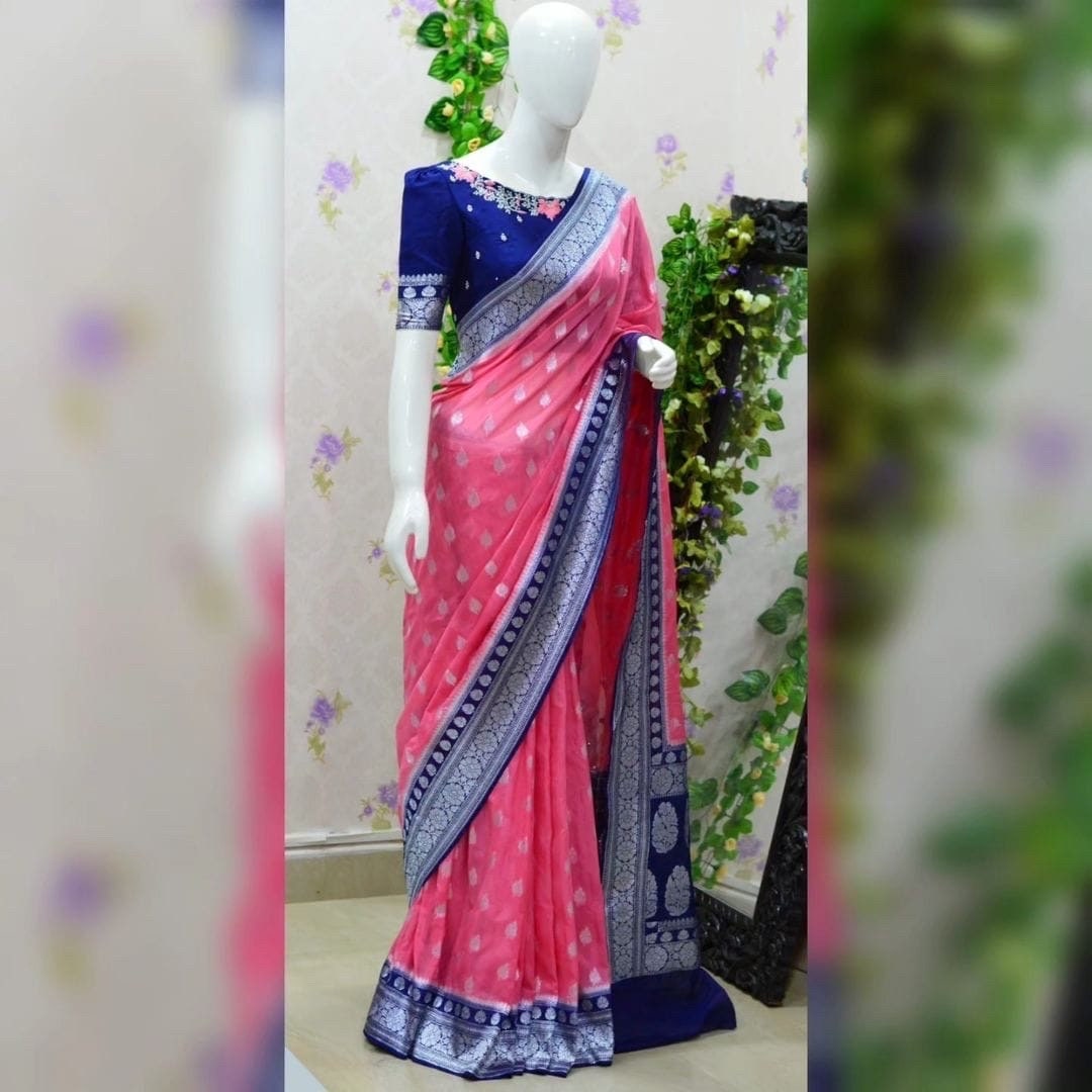 Beautiful banarasi kattan saree paired up with pretty maggam work blouse.