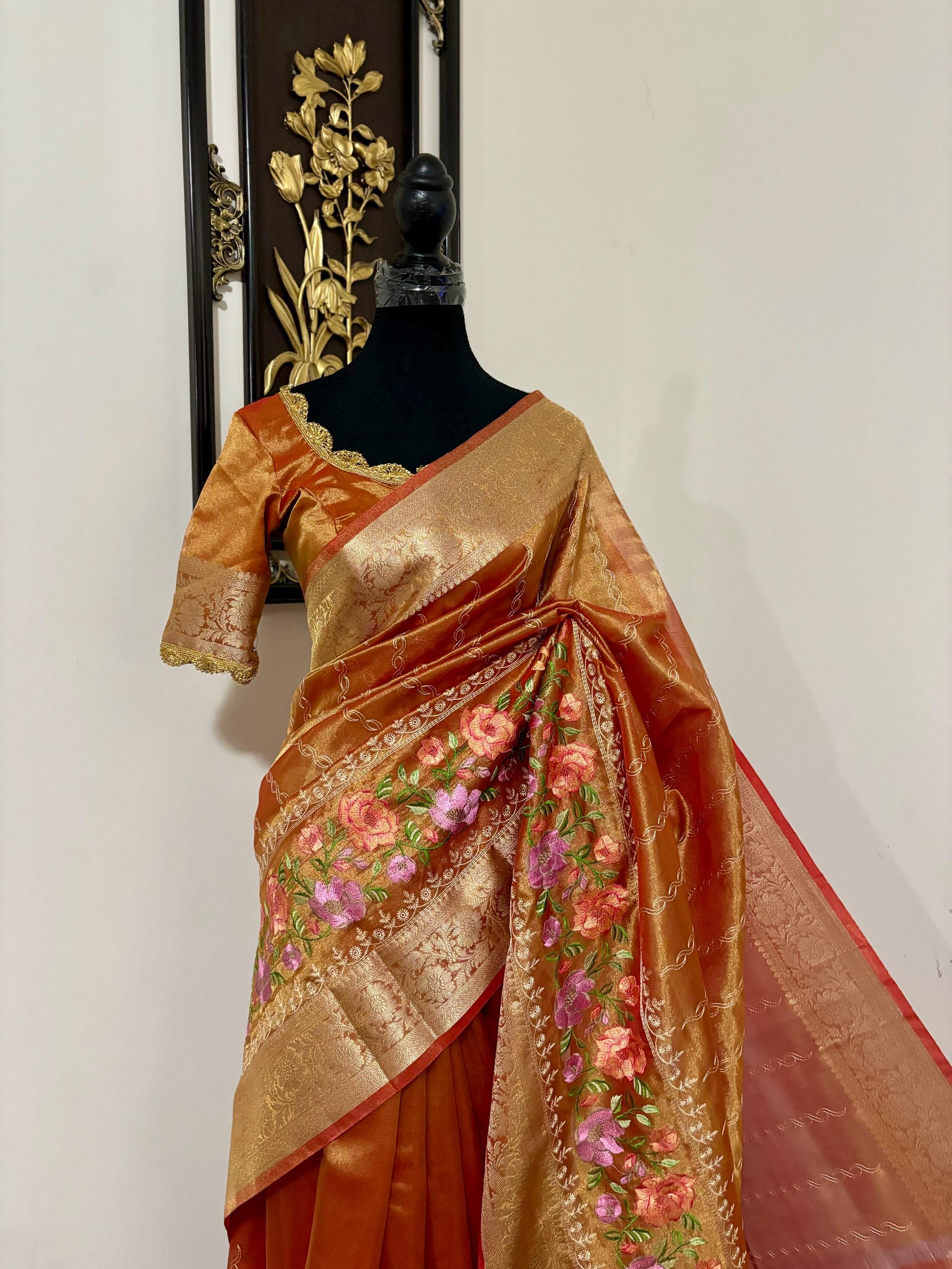 Banarasi  tissue saree with self weaving with beautifully embroidered boarder all over the sareeOrange Gold  shade rich weaving ready Blouse