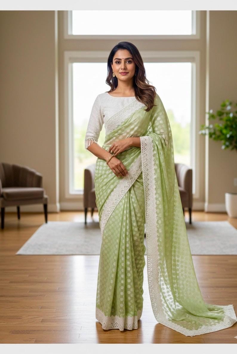 Beautiful soft falling  georgette on  sabyasachi  lace borders unique,  eye cooling pestal shades. Ready to wear designer blouse fits 32-44