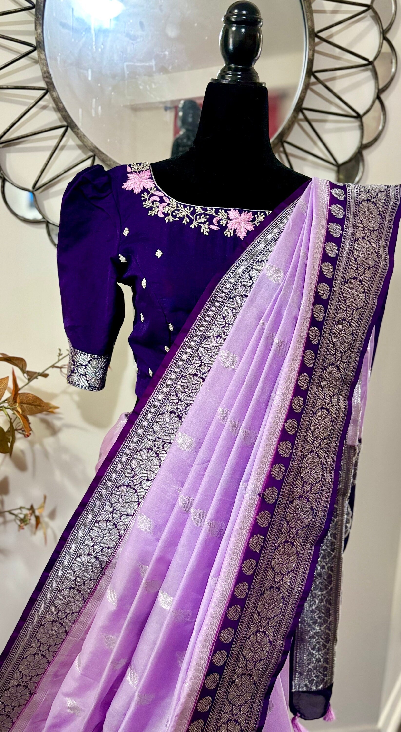 Beautiful banarasi saree paired up with pretty maggam work blouse.
