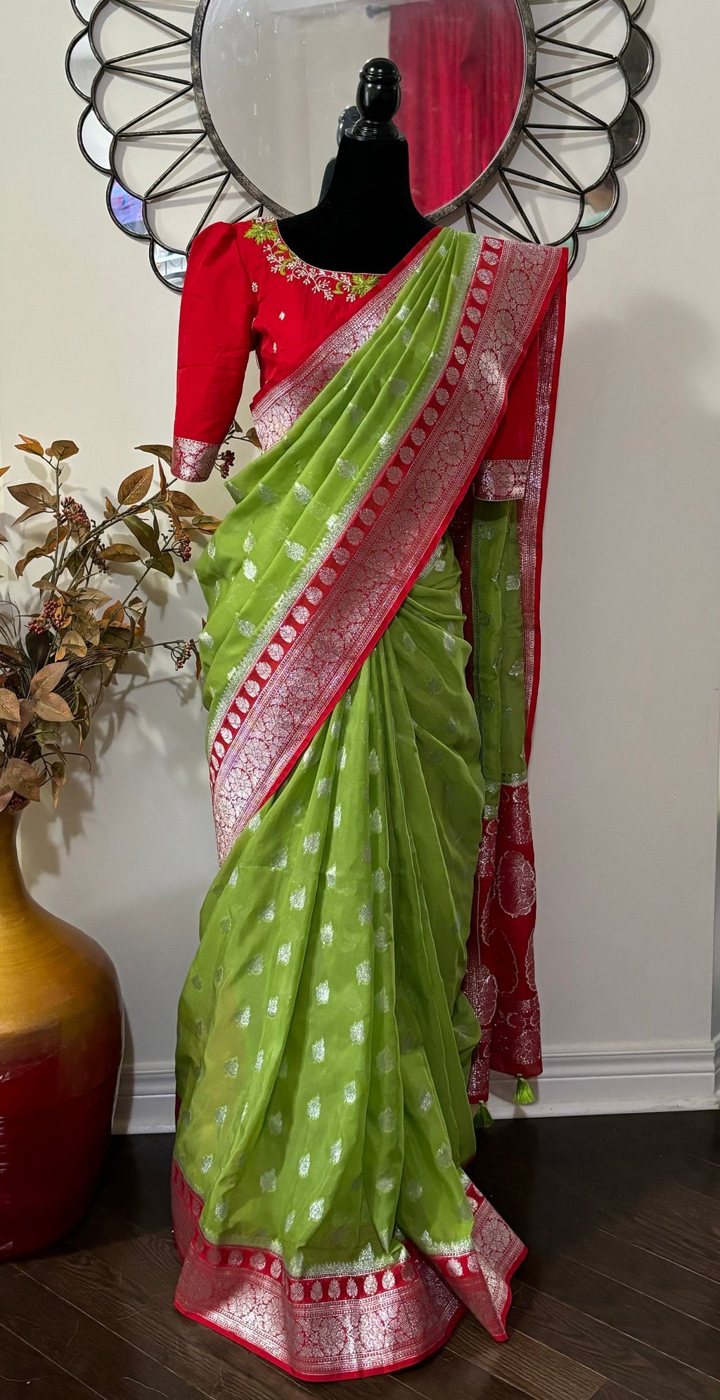 Beautiful banarasi saree paired up with pretty maggam work blouse.